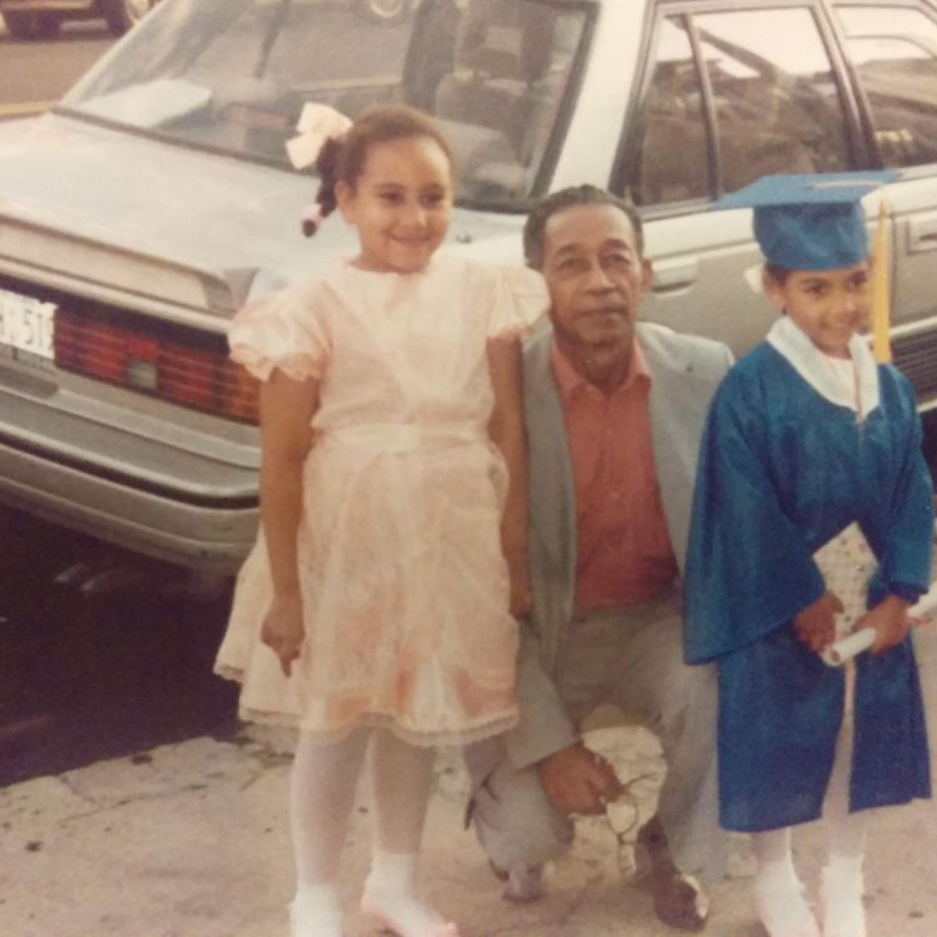 Oniqa and Sade Moonsammy as children with their grandfather, James Small.