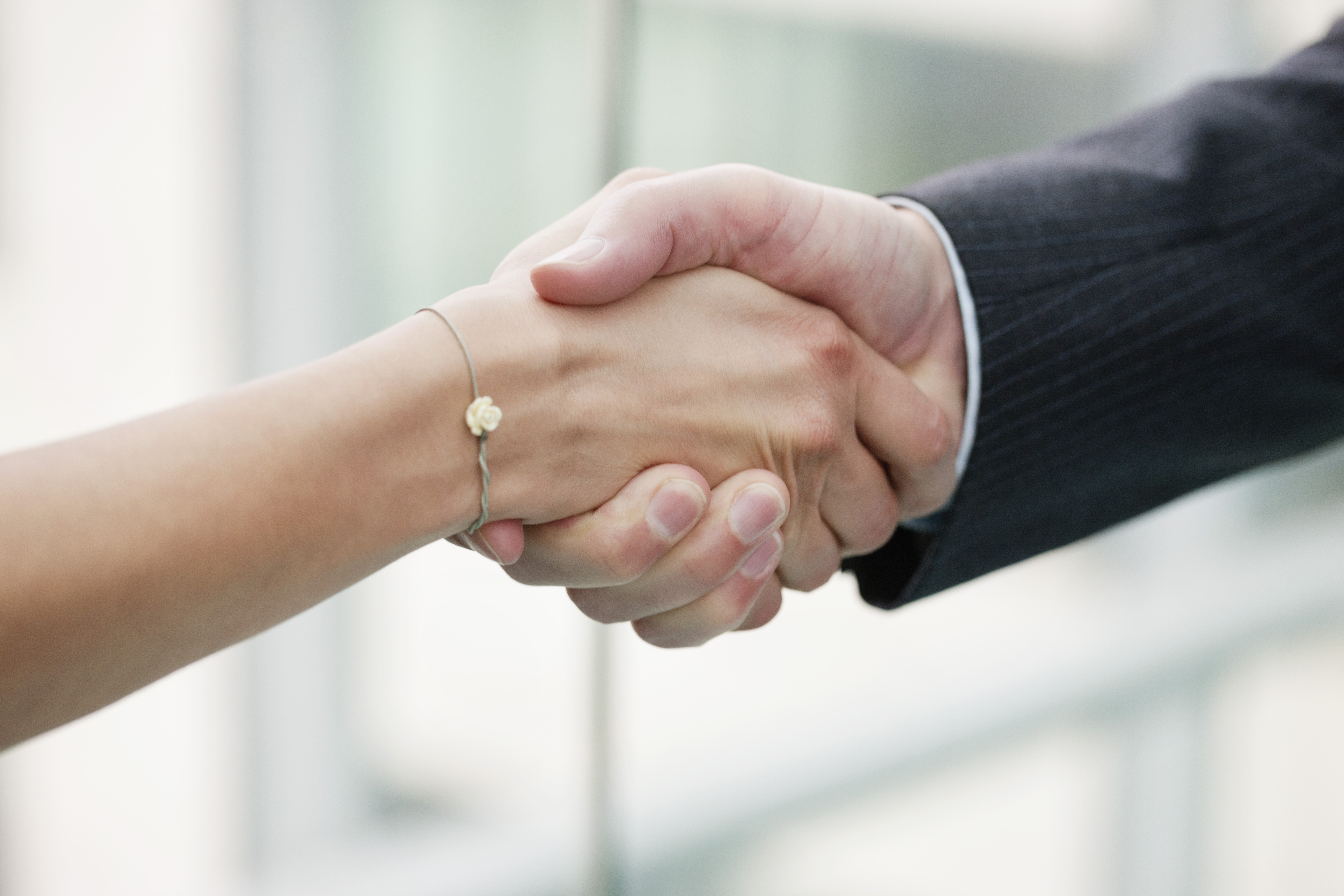 female-male-exec-handshake