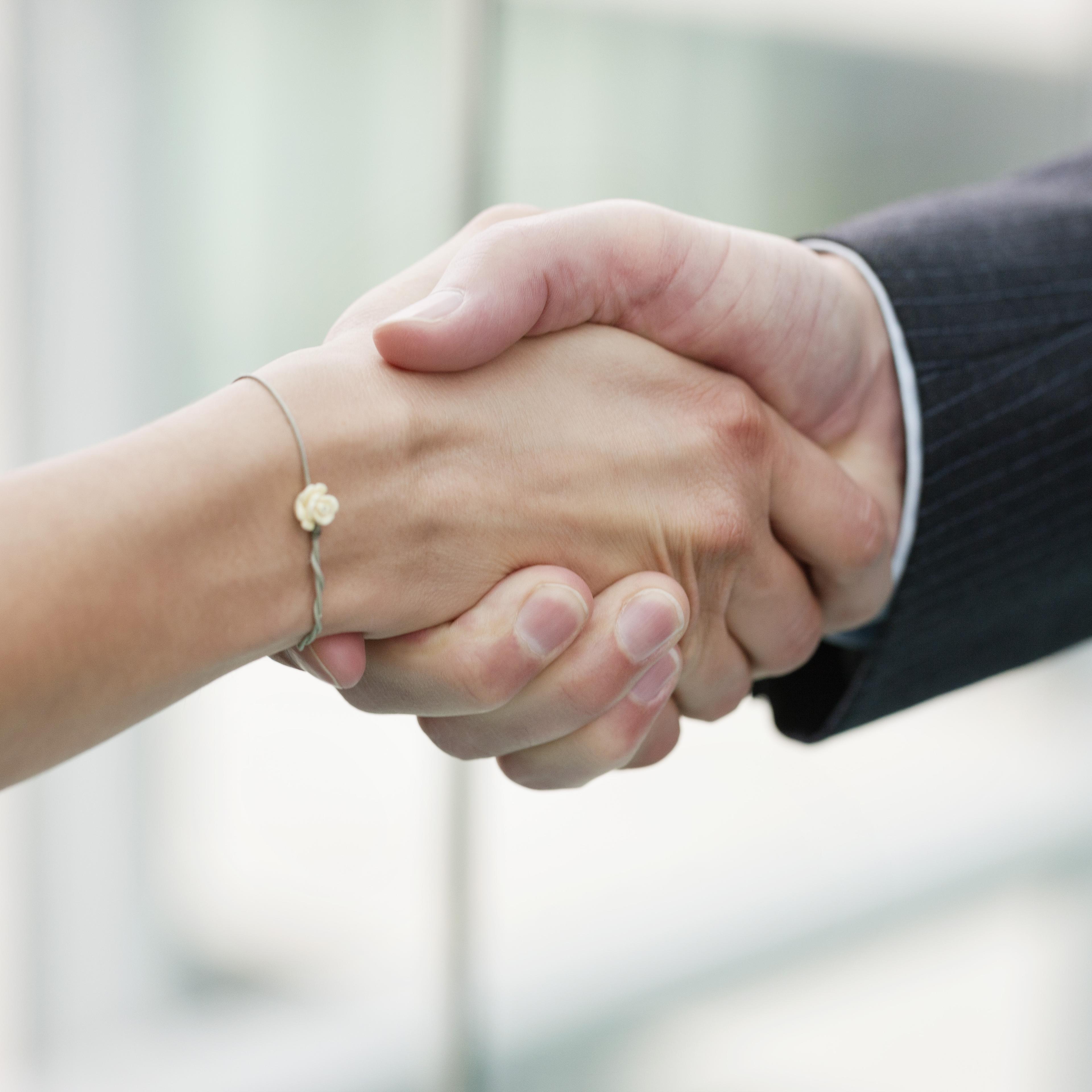 female-male-exec-handshake