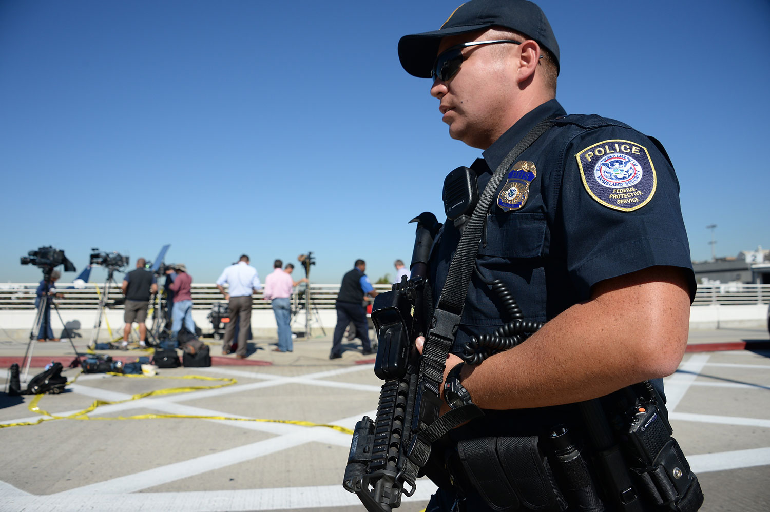 A policeman is positioned outside Terminal 3 at Los Angeles International Airport on November 1, 2013 after a gunman reportedly opened fire at a security checkpoint.