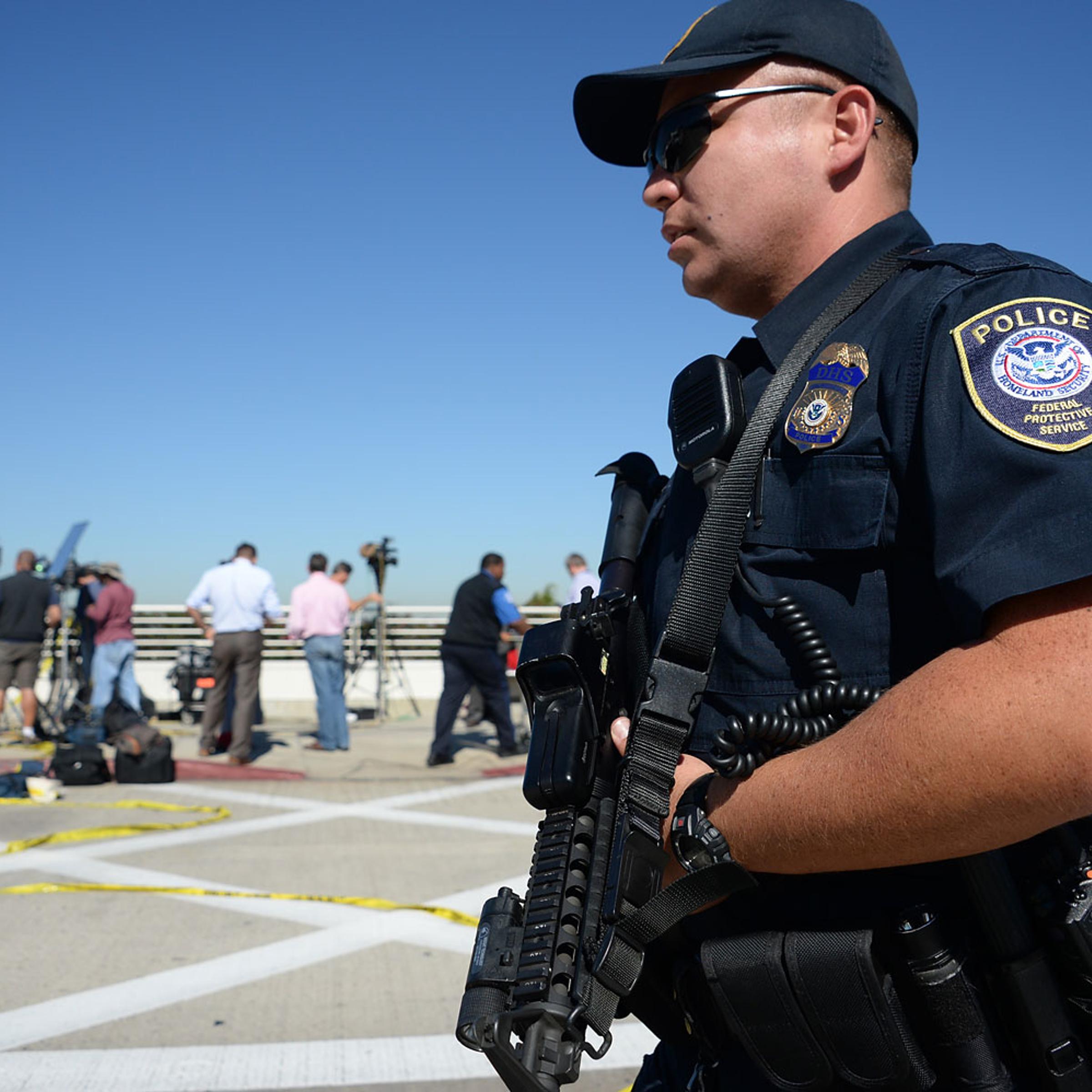 A policeman is positioned outside Terminal 3 at Los Angeles International Airport on November 1, 2013 after a gunman reportedly opened fire at a security checkpoint.