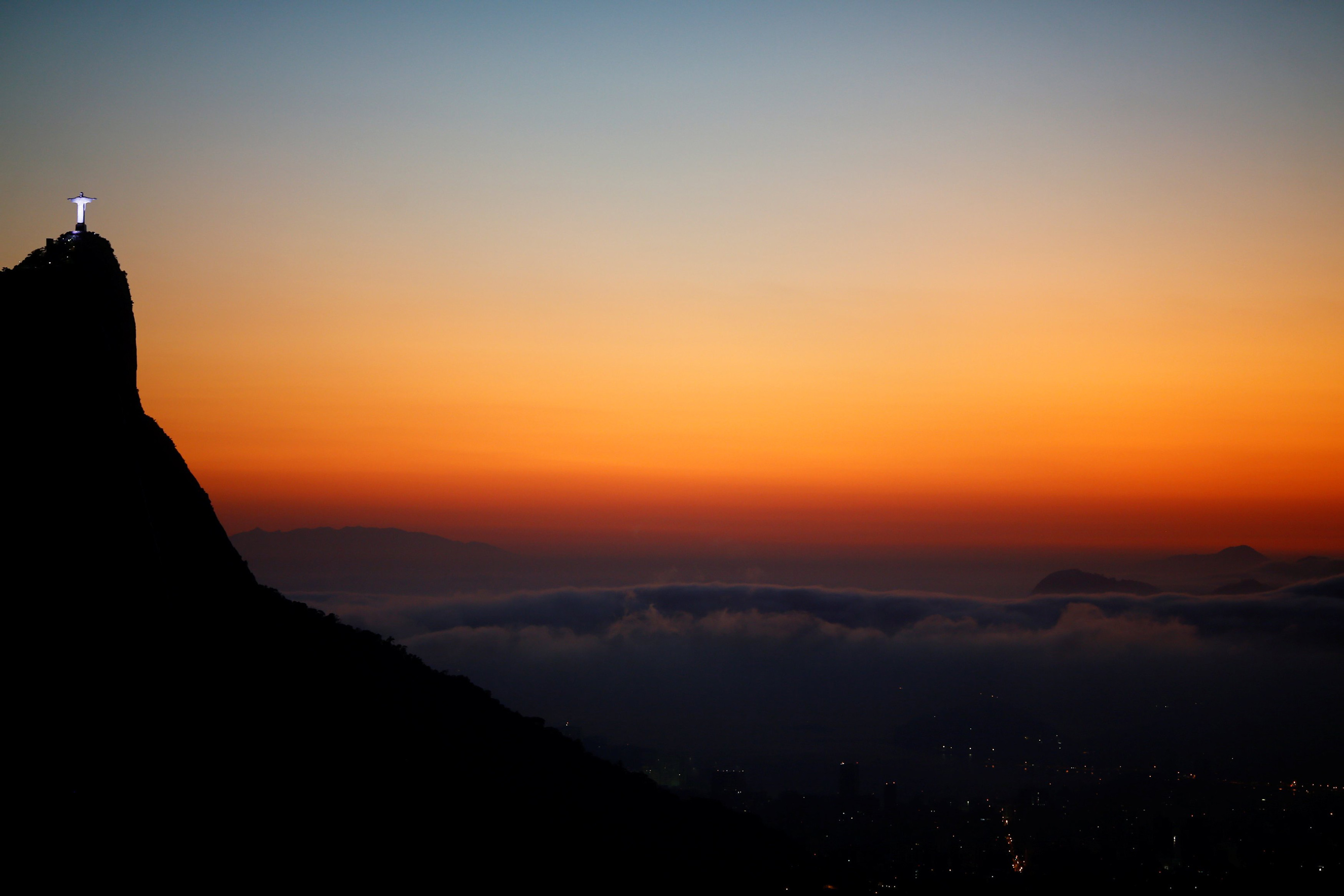 Christ the Redeemer is seen from the Vista Chinesa (Chinese View) during sunrise in Rio de Janeiro, May 4, 2016.