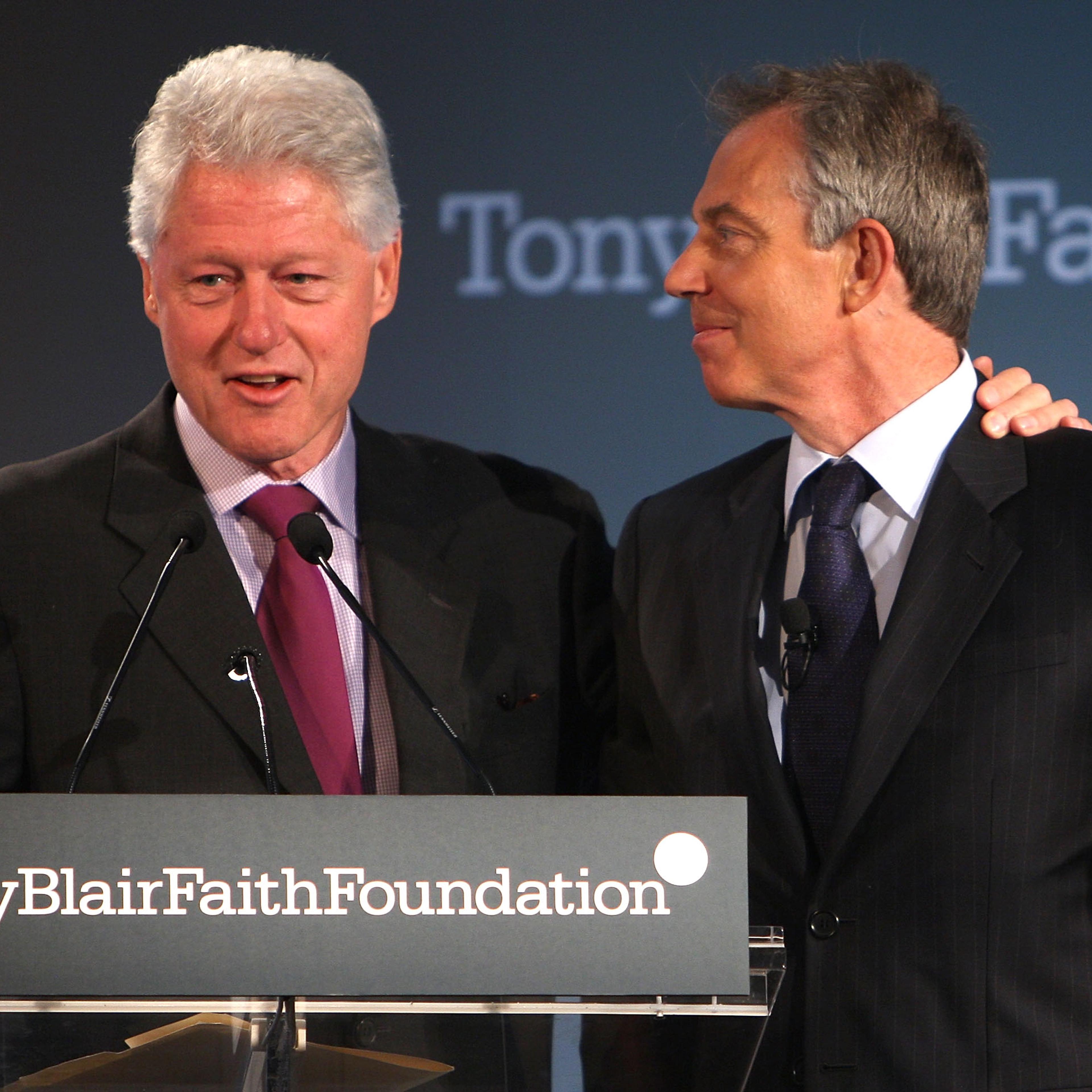 Former President Bill Clinton (L) addresses the audience while putting his arm around Former British Prime Minister Tony Blair during an event launching the Tony Blair Faith Foundation May 30, 2008 in New York.