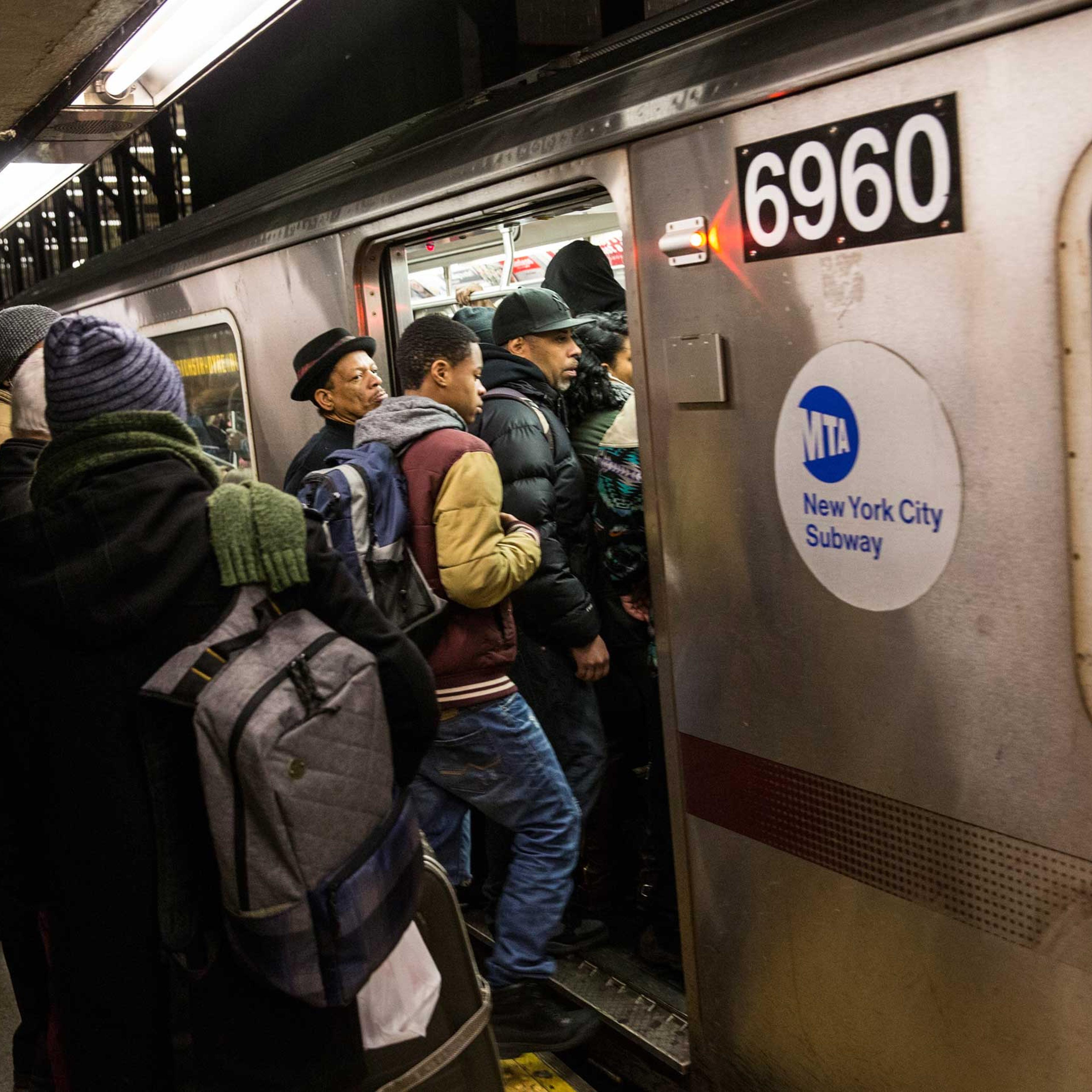 People board an uptown 5 train at Union Square on Jan. 28, 2015 in New York City.
