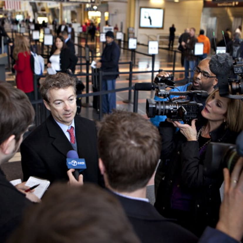 Senator Rand Paul, a Republican from Kentucky, speaks to the media after departing a flight at Ronald Reagan National Airport in Washington, D.C., U.S., on Monday, Jan. 23, 2012.