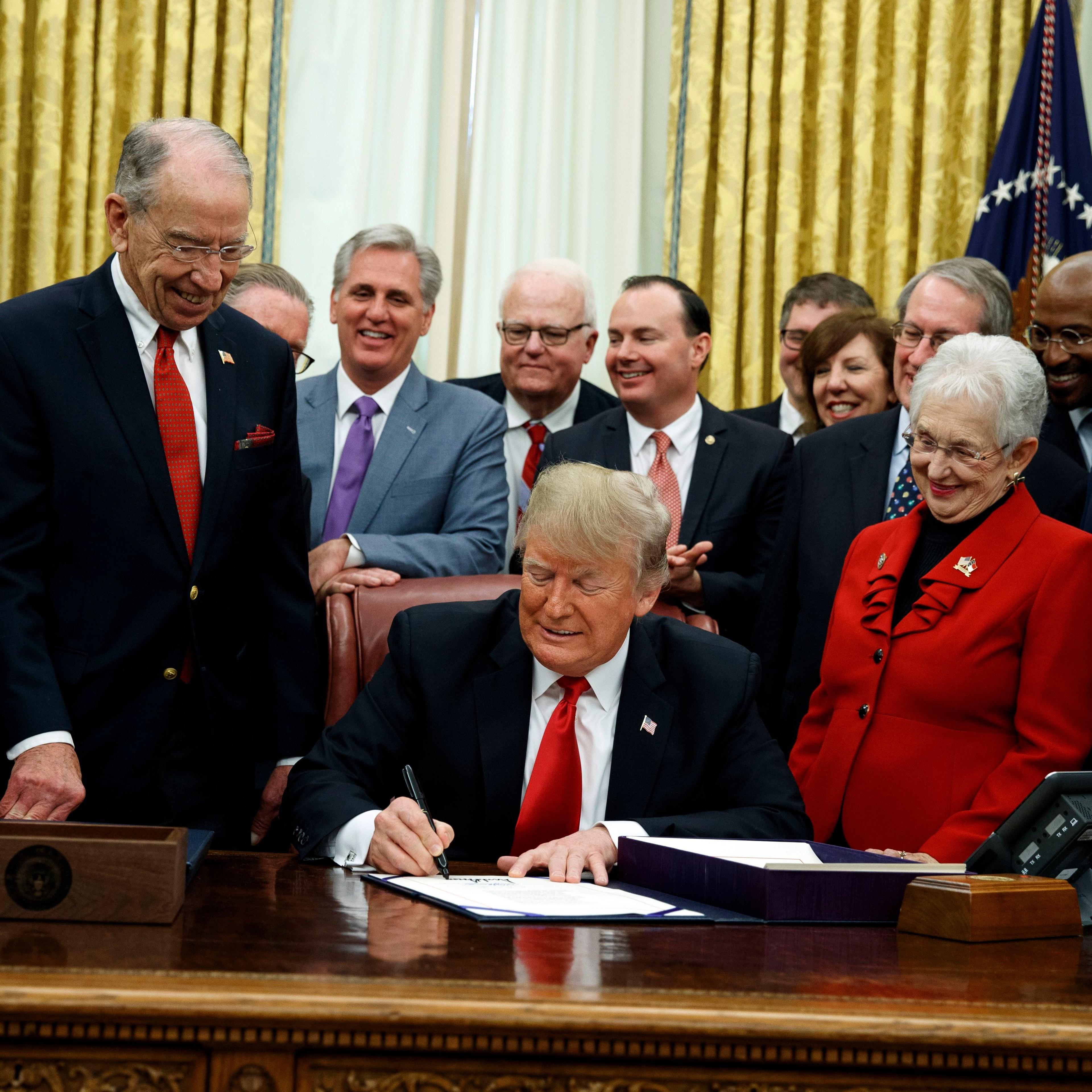 President Donald Trump signs criminal justice reform legislation