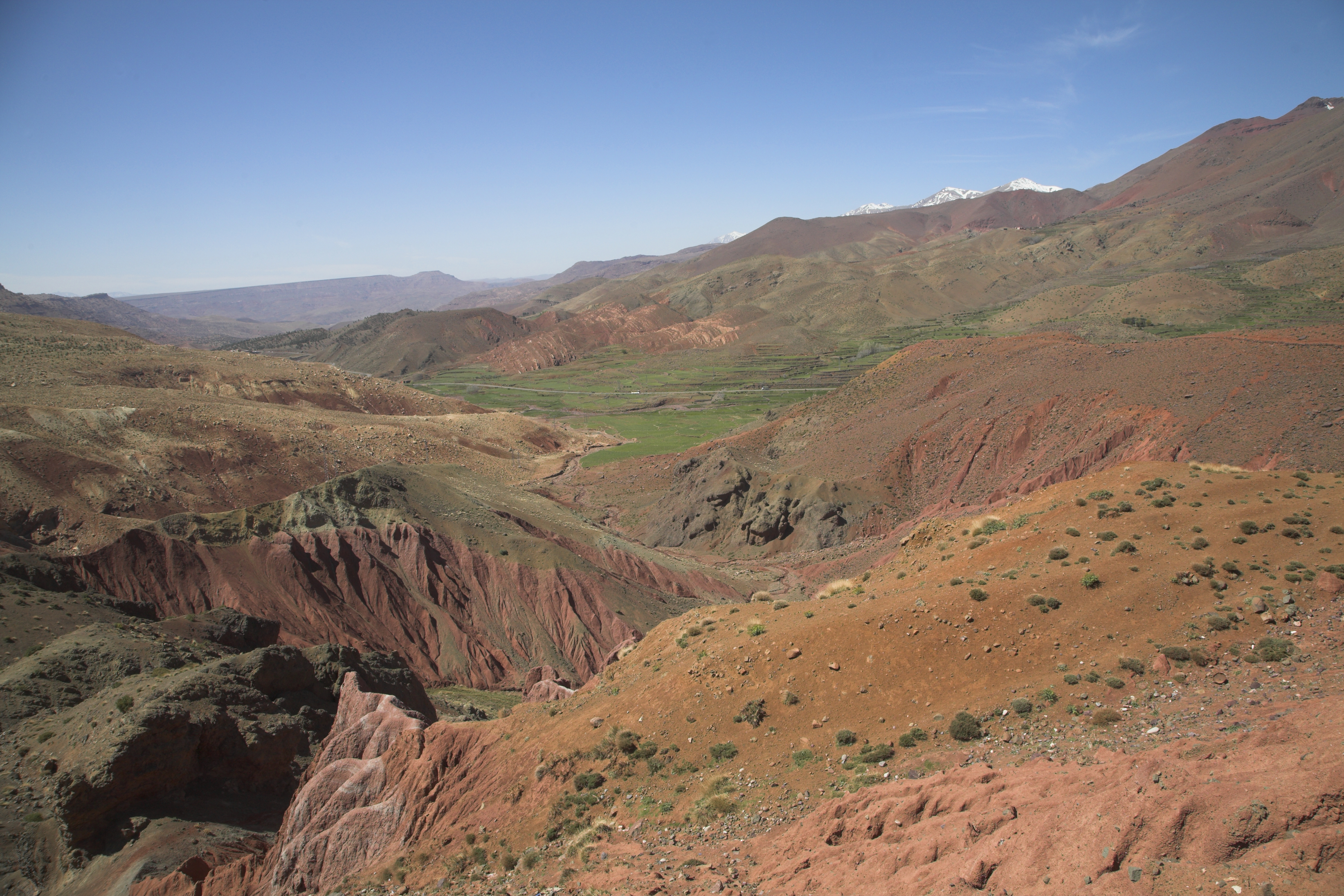 View over Atlas Mountain with gully and distant snowy peaks of Jebel Toubkal range Morocco, north Africa