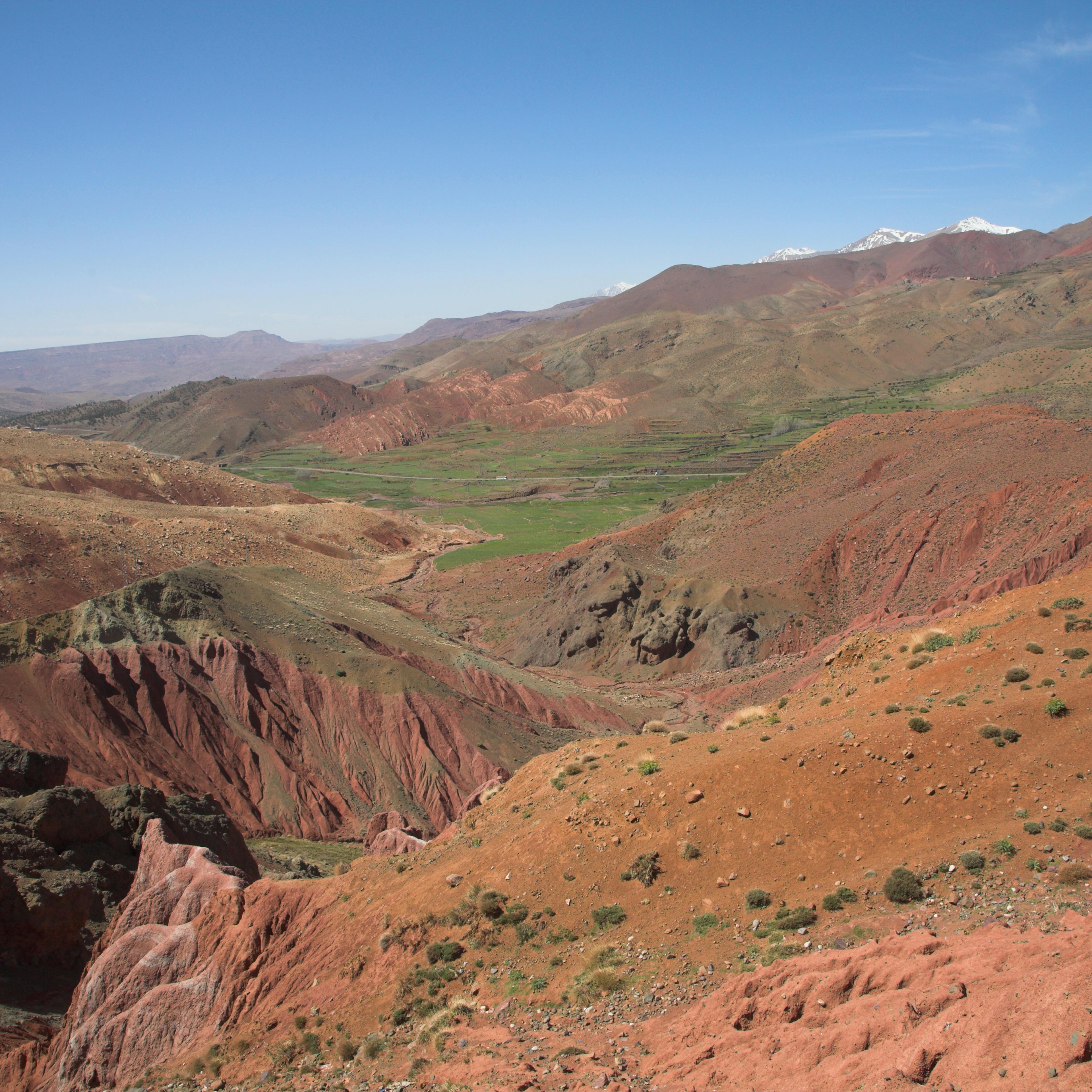 View over Atlas Mountain with gully and distant snowy peaks of Jebel Toubkal range Morocco, north Africa
