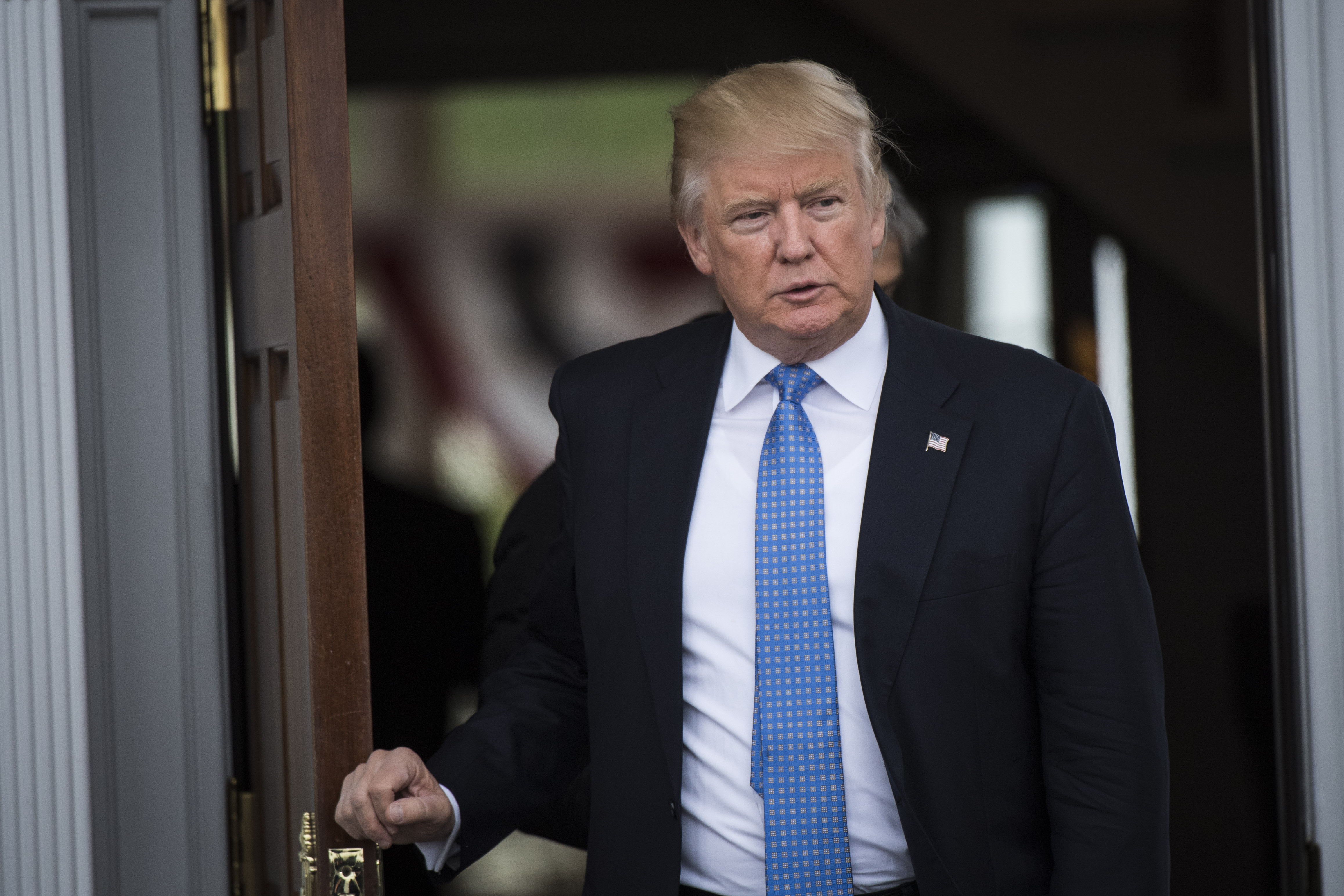President-elect Donald Trump walks out at the clubhouse at Trump National Golf Club Bedminster in Bedminster Township, N.J. on Nov. 20, 2016.