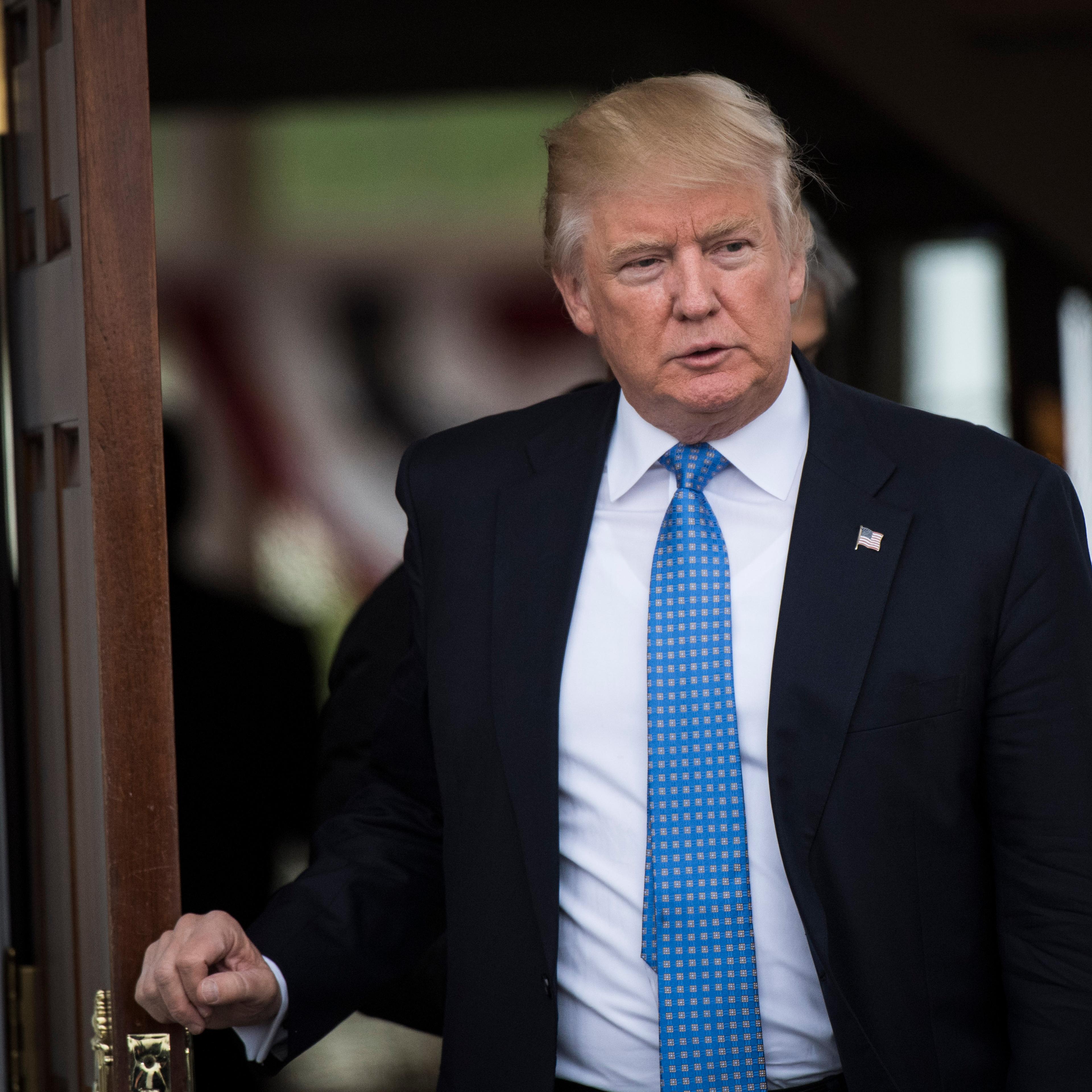 President-elect Donald Trump walks out at the clubhouse at Trump National Golf Club Bedminster in Bedminster Township, N.J. on Nov. 20, 2016.