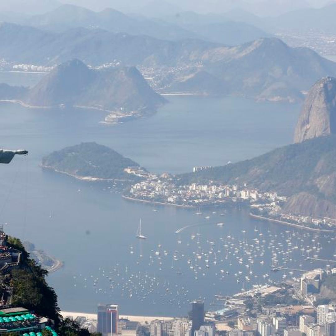 Tourists visit the Christ the Redeemer statue in Rio de Janeiro