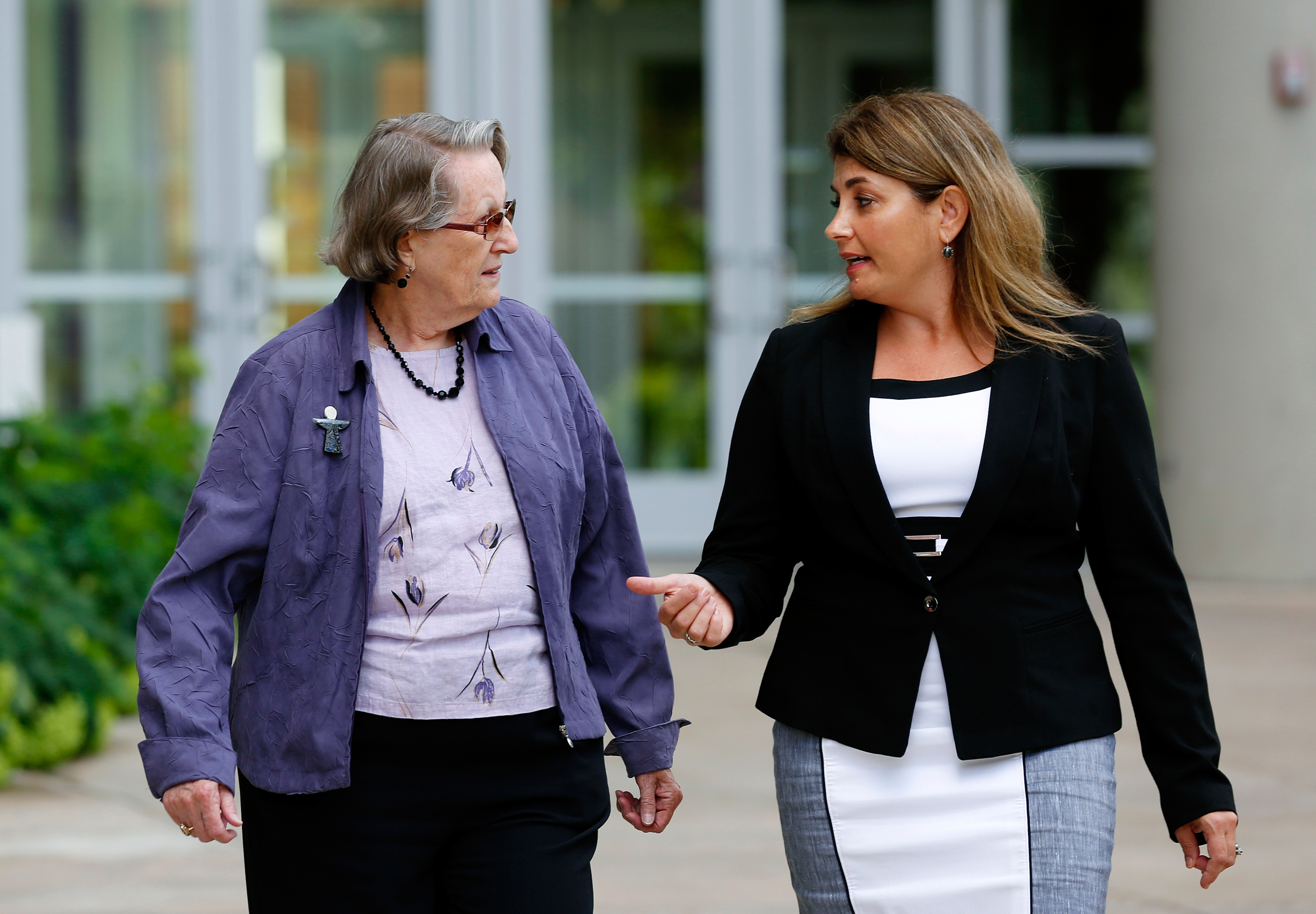 CORRECTS IDENTIFICATION - In this Aug. 11, 2016 photo, Angela McArthur, right, director of the Anatomy Bequest Program at the University of Minnesota Medical School, walks with Jean Larson, widow of a donor in Minneapolis. Once a relatively rare option, 
