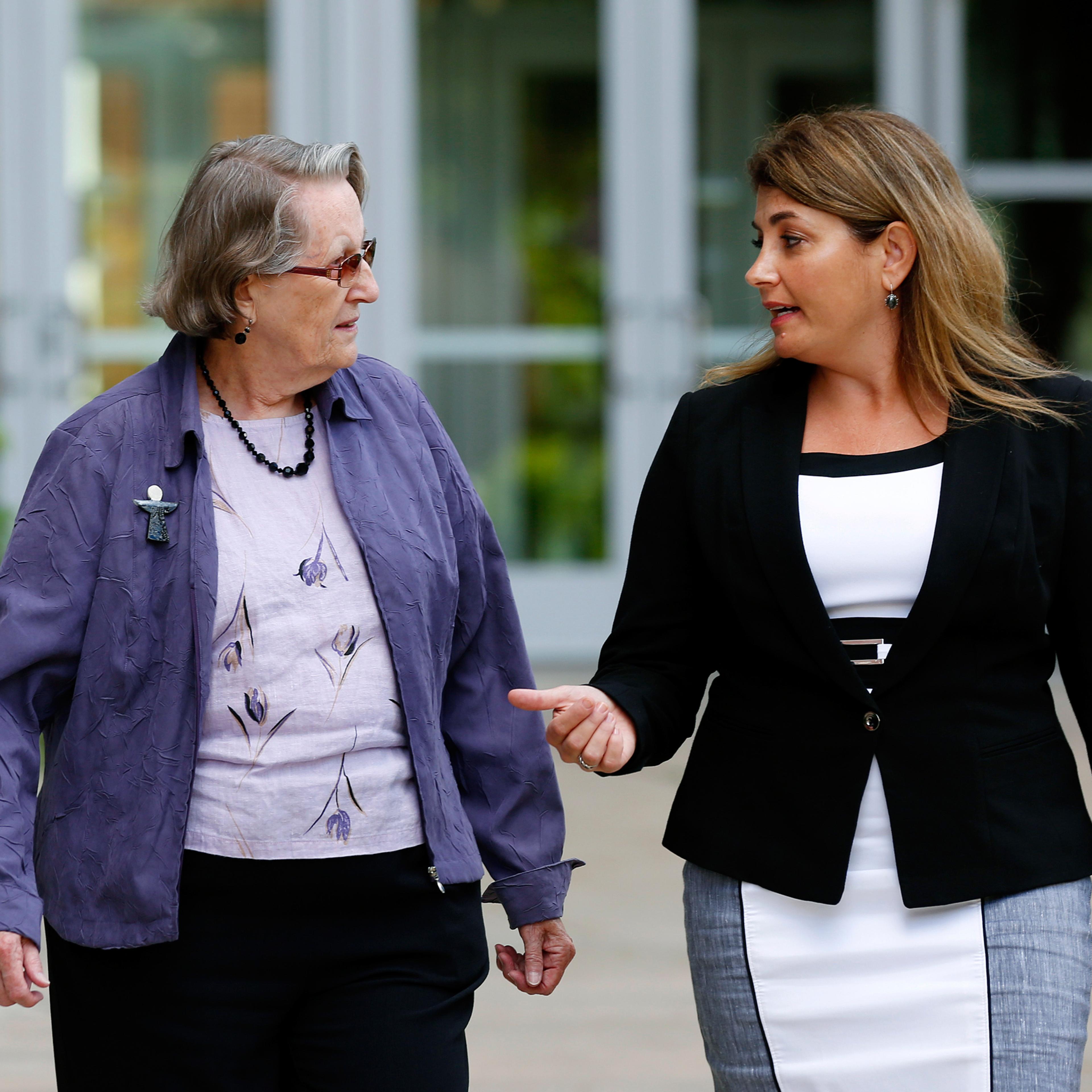 CORRECTS IDENTIFICATION - In this Aug. 11, 2016 photo, Angela McArthur, right, director of the Anatomy Bequest Program at the University of Minnesota Medical School, walks with Jean Larson, widow of a donor in Minneapolis. Once a relatively rare option,