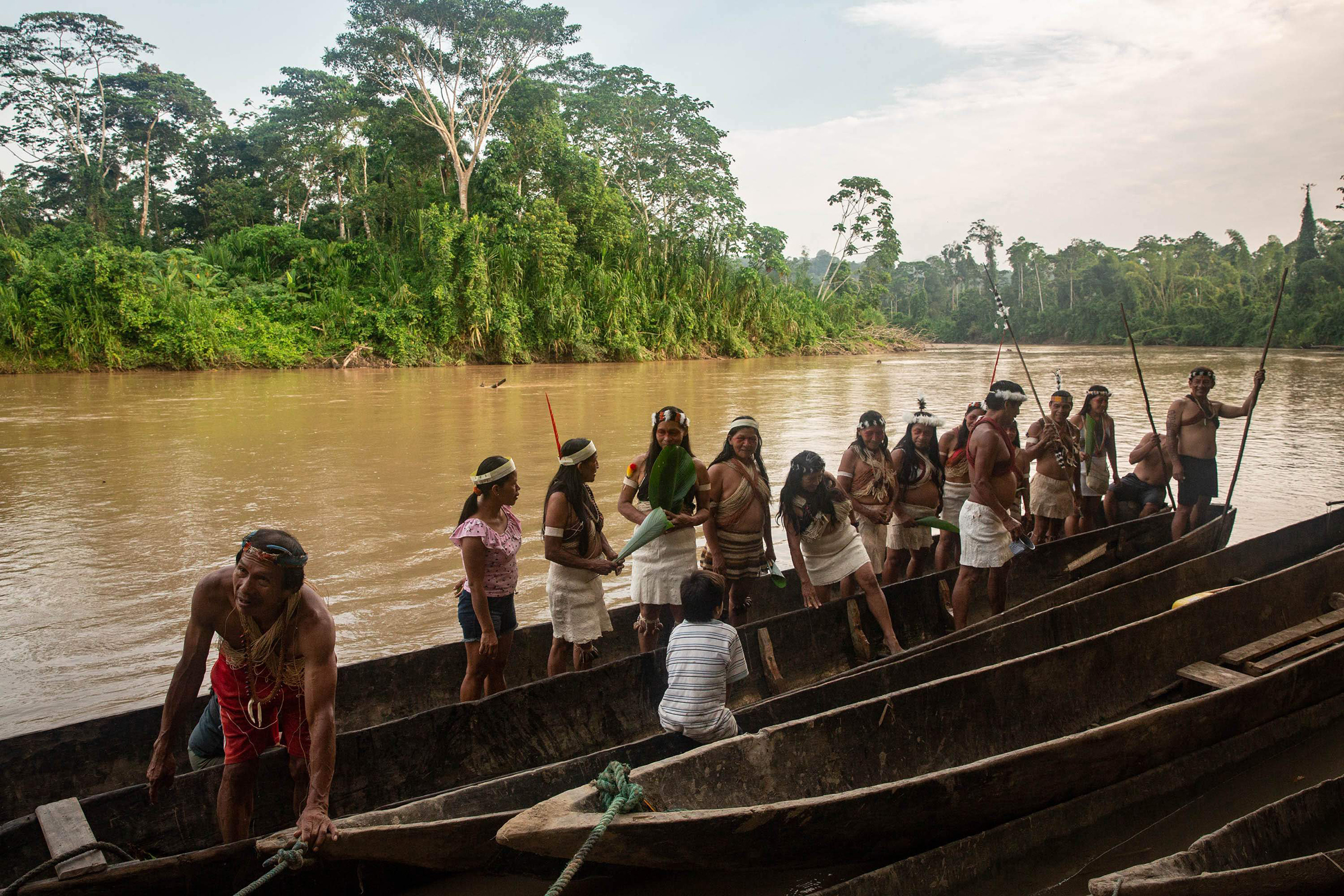 Waorani people embark on a canoe journey along the Curaray river in ancestral Waorani territory, Ecuadorian Amazon, in March.