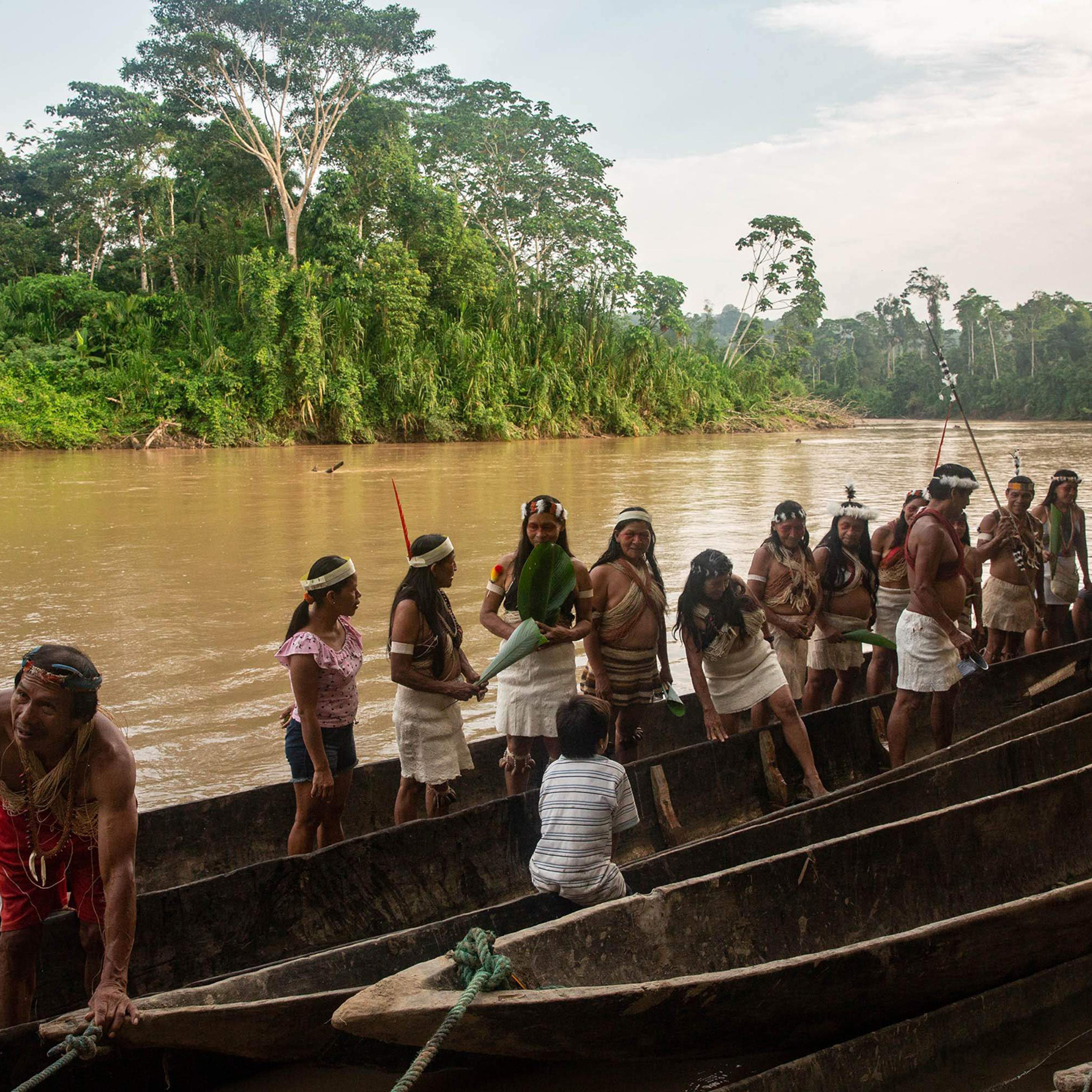Waorani people embark on a canoe journey along the Curaray river in ancestral Waorani territory, Ecuadorian Amazon, in March.
