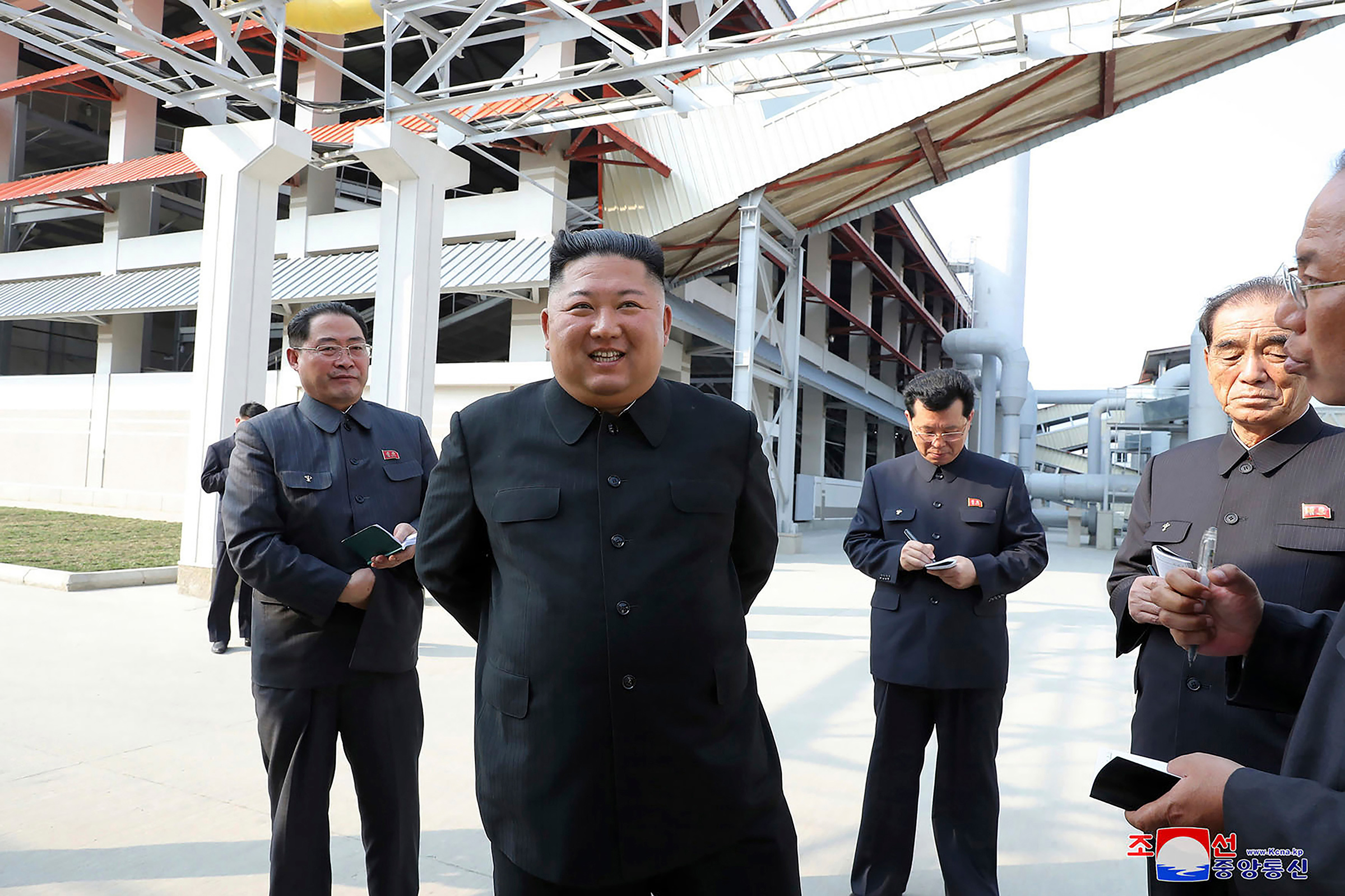 In this Friday, May 1 photo provided by the North Korean government, North Korean leader Kim Jong Un, center, visits a fertilizer factory in Sunchon, South Pyongan province, near Pyongyang.