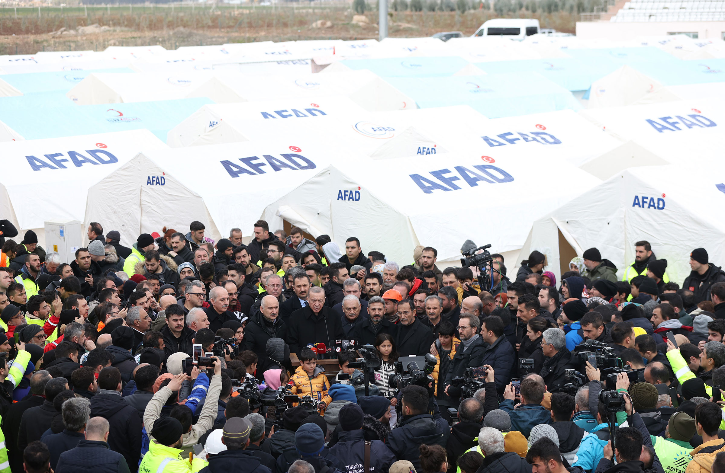 Turkish President Recep Tayyip Erdogan speaks to media after visiting the tent city in quake hit Adiyaman, Turkey on Feb. 10, 2023.