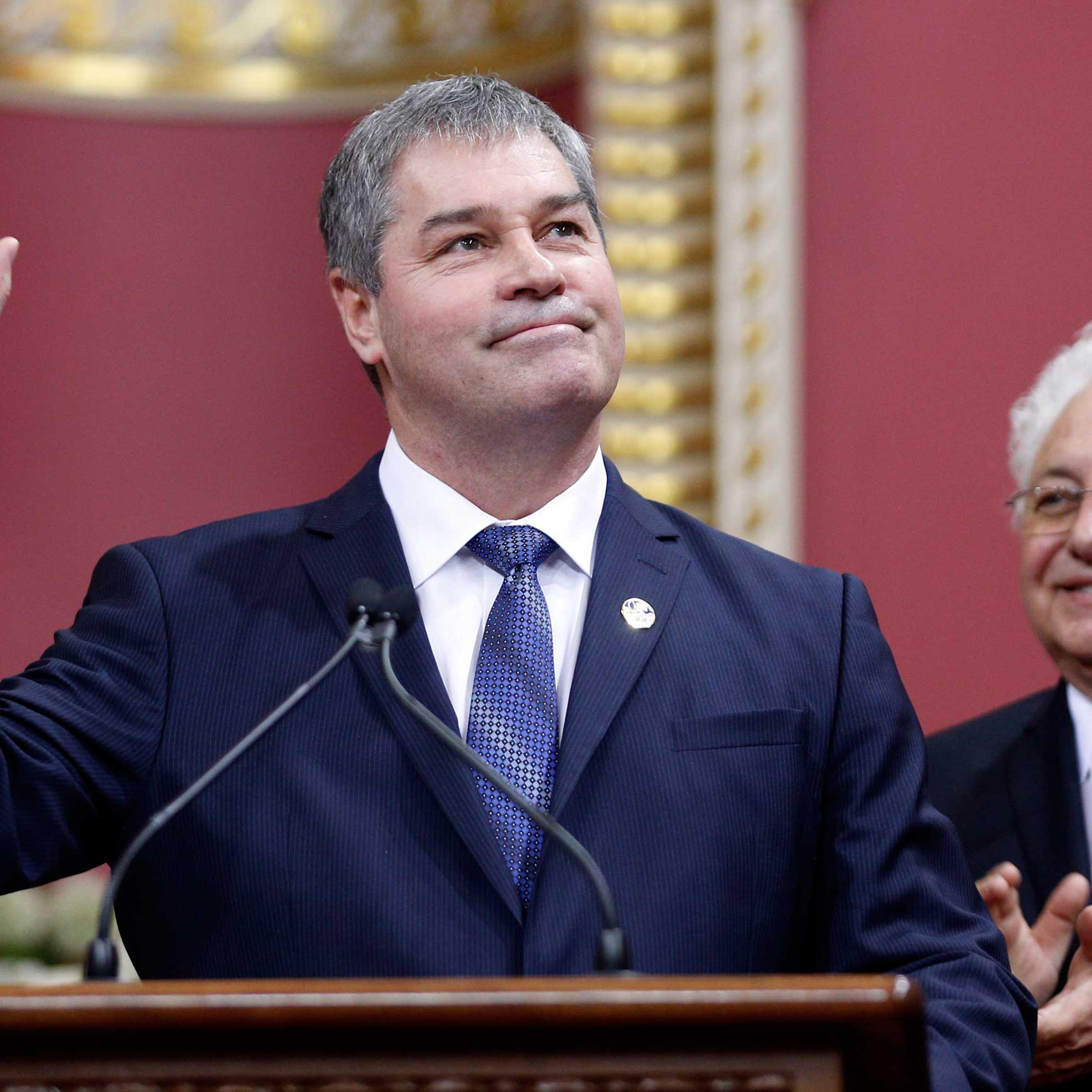 Quebec's Minister of Education Yves Bolduc waves to the crowd after being appointed by Premier Philippe Couillard during a swearing-in ceremony at the National Assembly in Quebec City, April 23, 2014.