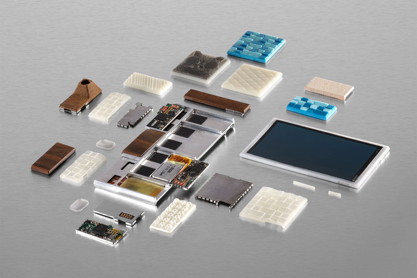 Parts of a functional prototype of a Project Ara phone -- still a work in progress -- including the endoskeleton frame, the screen, electrical components and custom 3D-printed module enclosures.