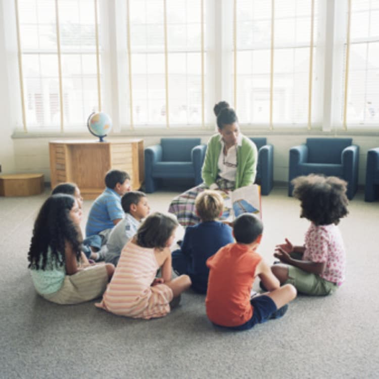 teacher-students-circle-reading