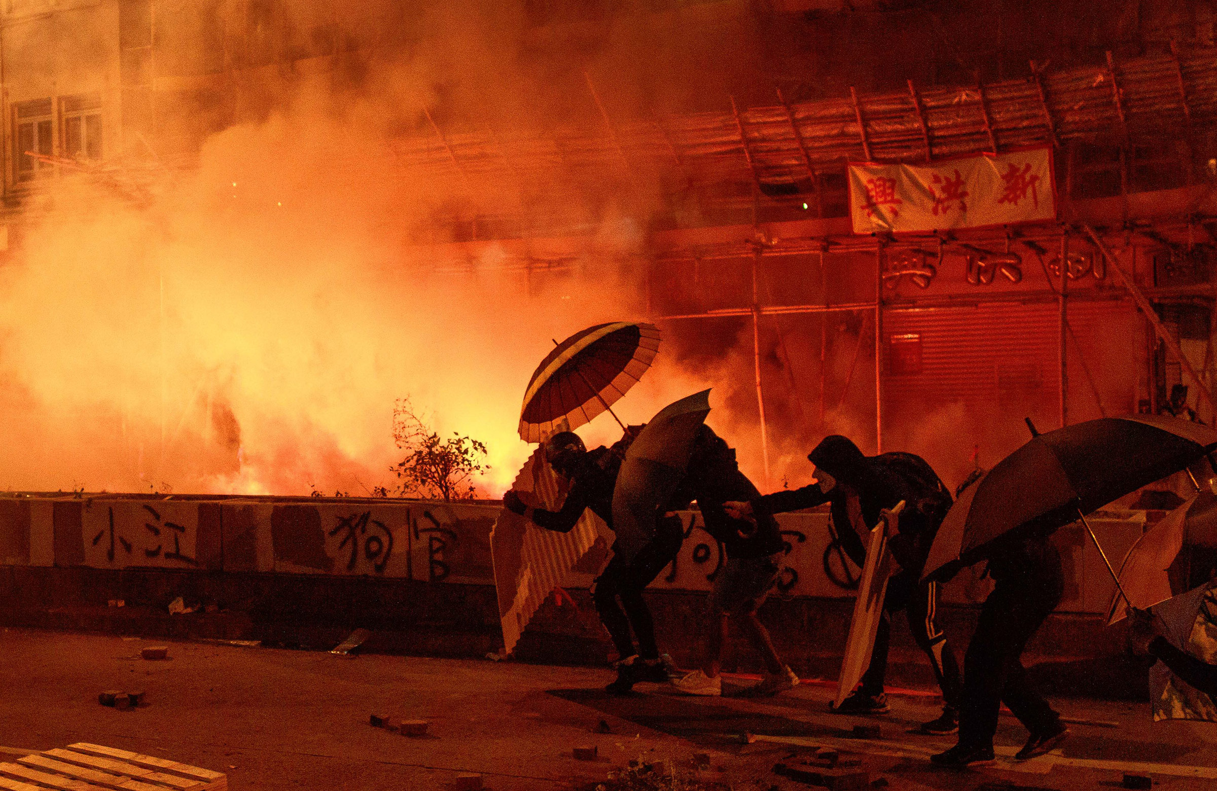 Protestors attempting tp reach Hong Kong Polytechnic University on Nov. 18 ace off against police