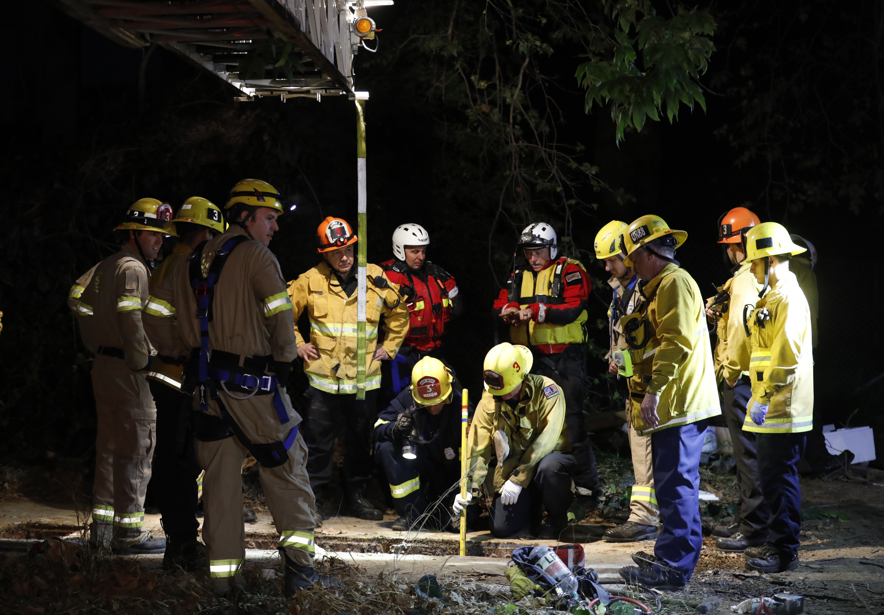 Los Angeles firefighters search for 13-year-old Jesse Hernandez after he fell into a sewage system