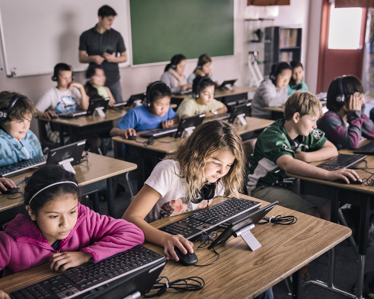 The national shift to computers in the classroom is happening fast, with paper, textbooks and pencils replaced by tablets, headphones and keyboards