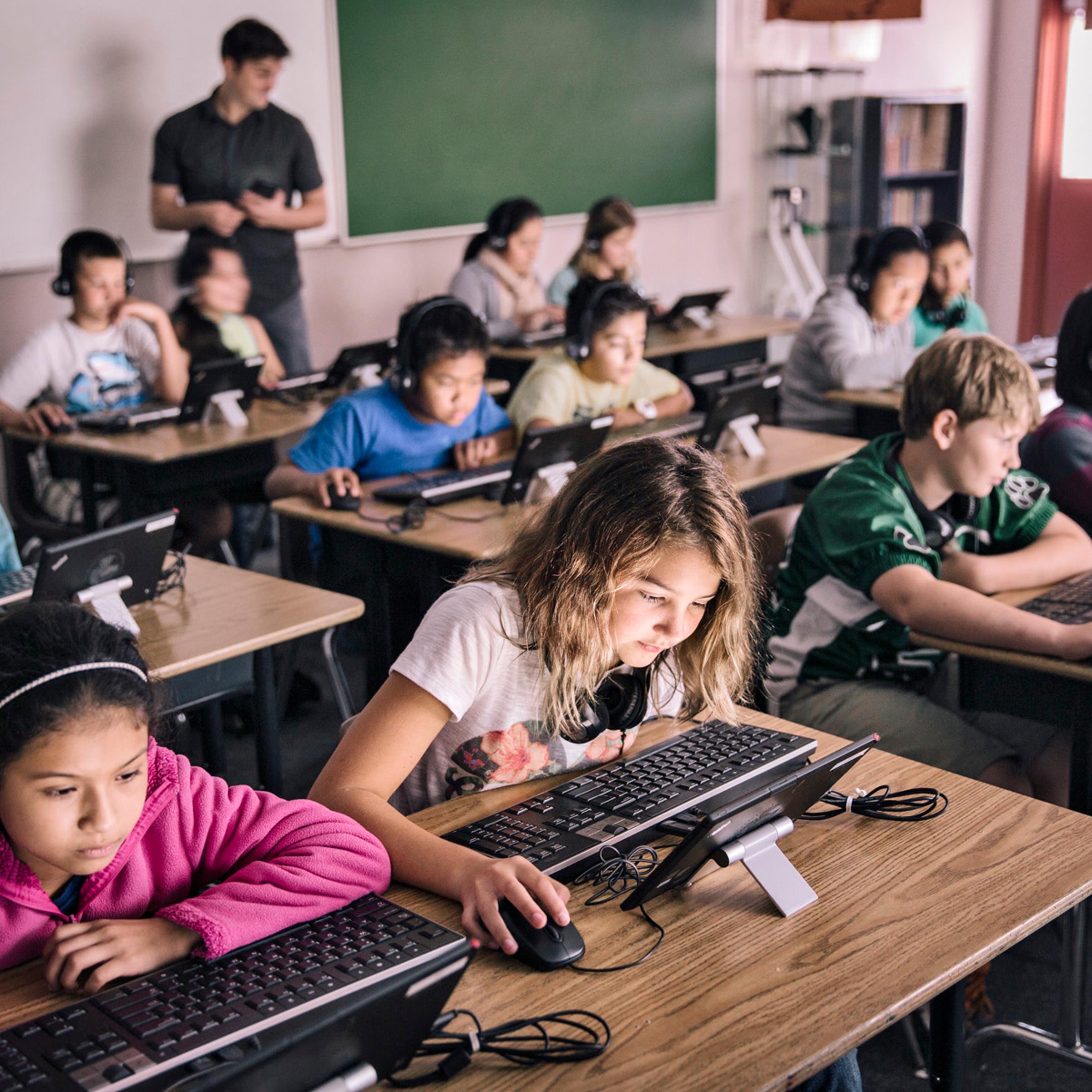 The national shift to computers in the classroom is happening fast, with paper, textbooks and pencils replaced by tablets, headphones and keyboards