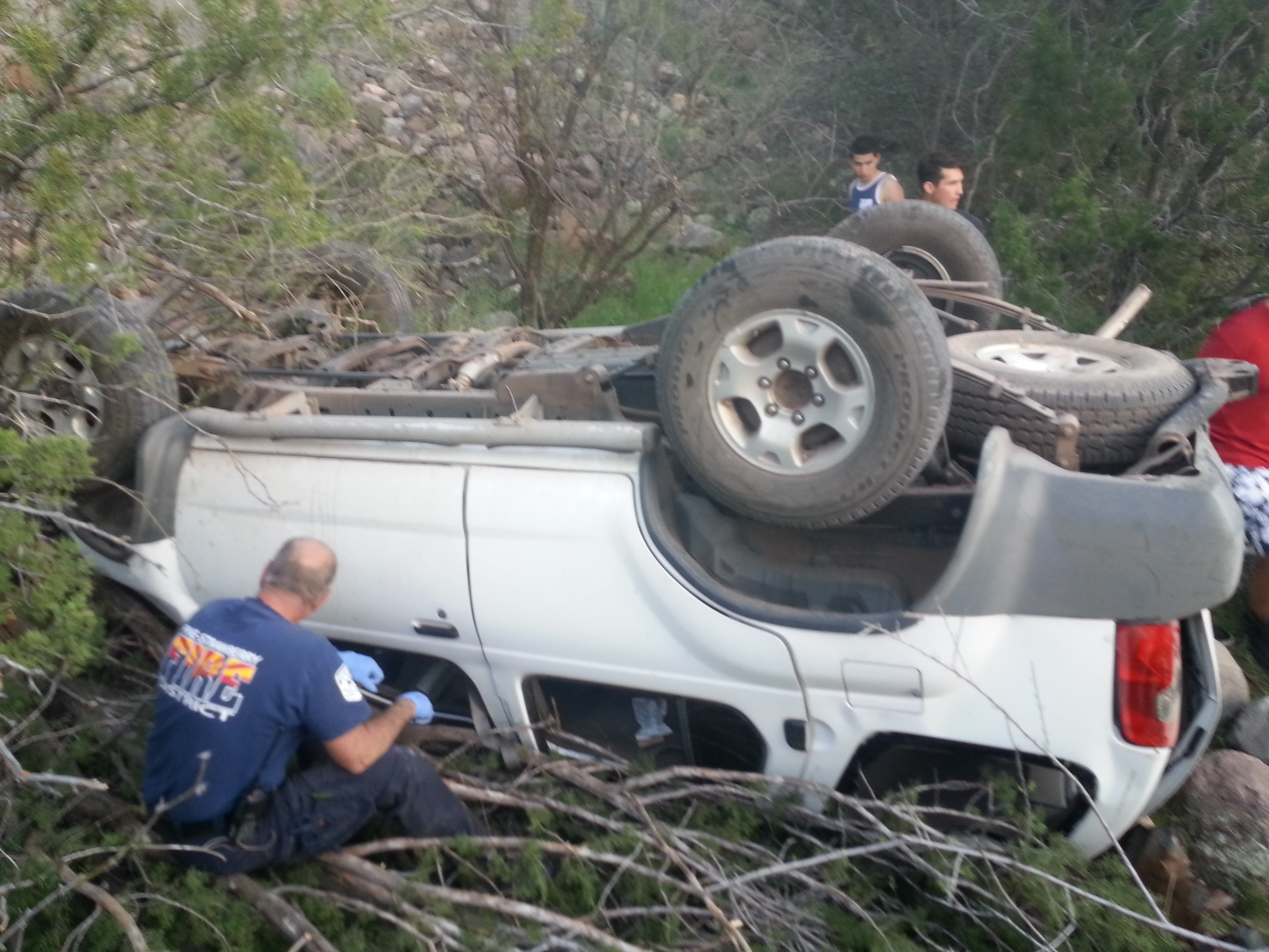 The driver involved in the accident was trapped under the overturned vehicle for approximately four hours until firefighters were able to extricate her on April 1, 2015.