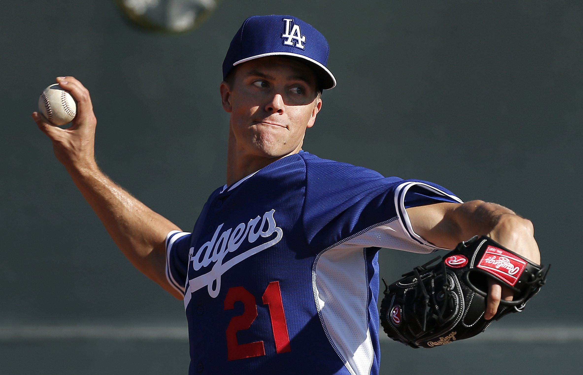 Los Angeles Dodgers pitcher Zack Greinke throws during spring training baseball practice in Glendale, Ariz.