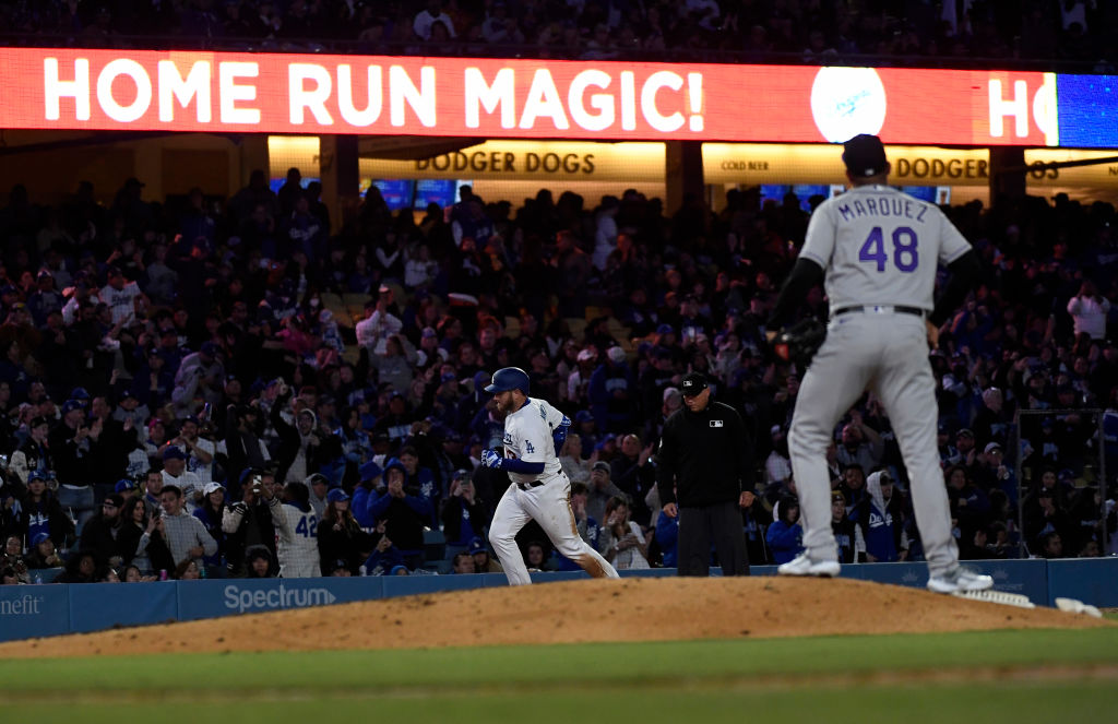 Max Muncy (#13) of the Los Angeles Dodgers hits a solo home run against starting pitcher German Marquez (#48) at Dodger Stadium in Los Angeles, on April 4, 2023.