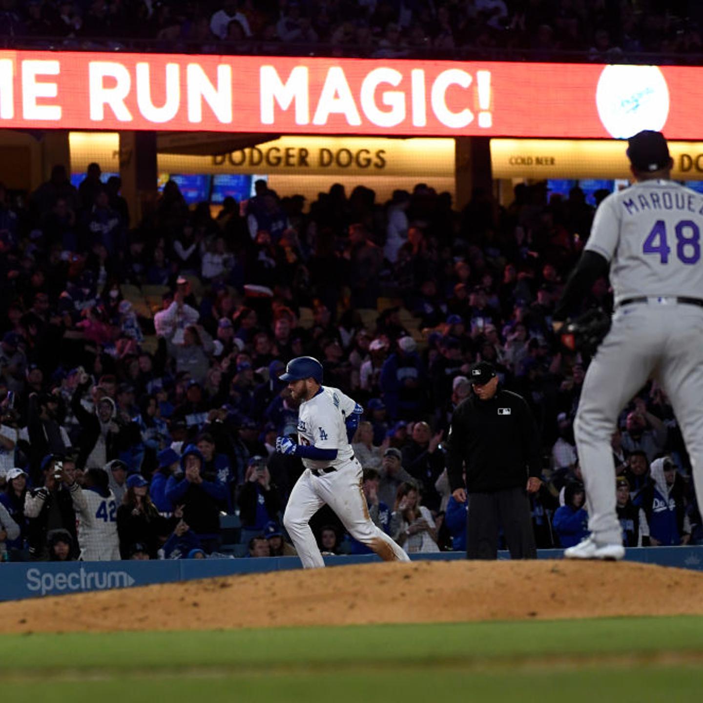 Max Muncy (#13) of the Los Angeles Dodgers hits a solo home run against starting pitcher German Marquez (#48) at Dodger Stadium in Los Angeles, on April 4, 2023.
