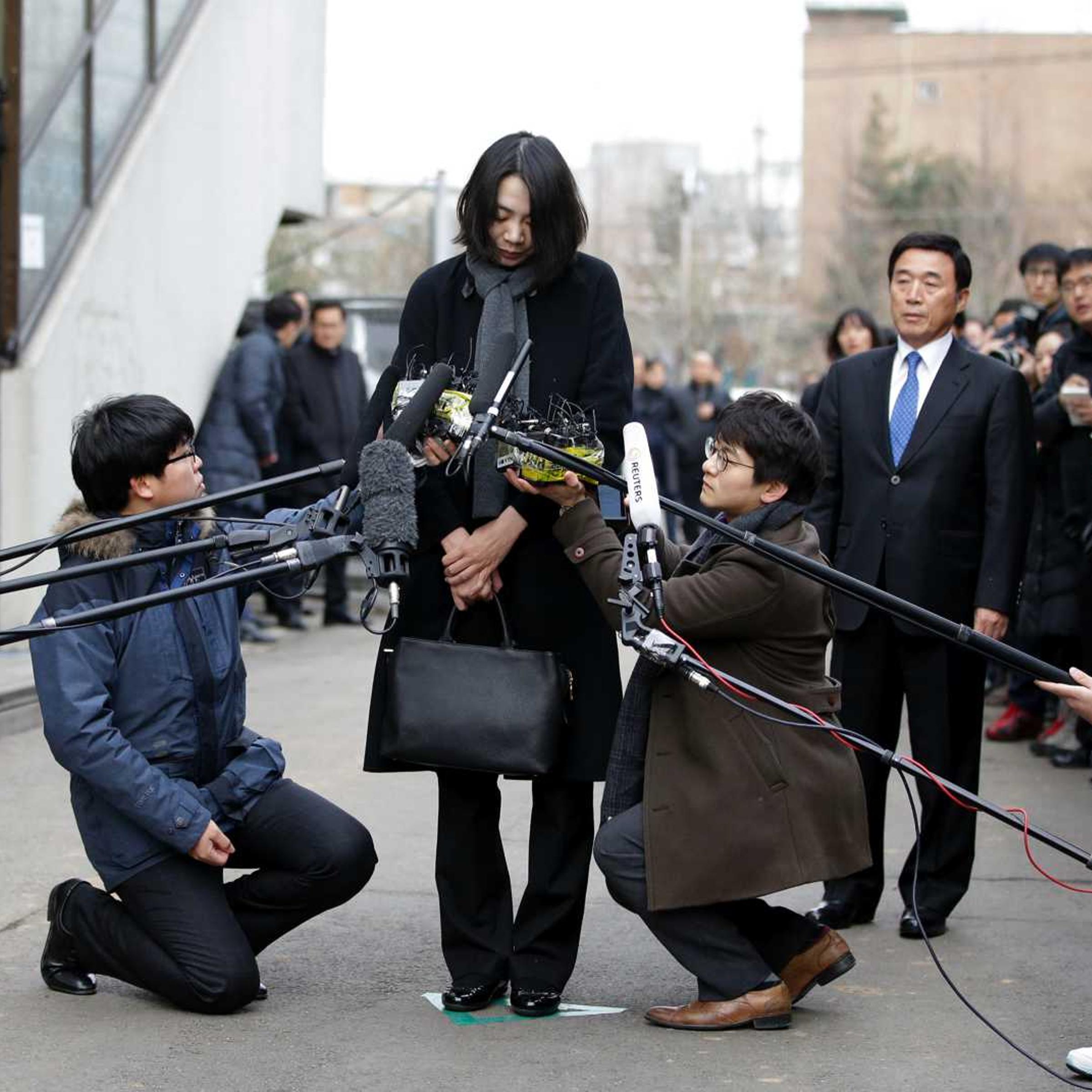 In this Friday, Dec. 12, 2014 photo, Cho Hyun-ah, who was head of cabin service at Korean Air and the oldest child of Korean Air chairman Cho Yang-ho, speaks to the media upon her arrival for questioning at the Aviation and Railway Accident Investigation Board office of Ministry of Land, Infrastructure and Transport in Seoul, South Korea.