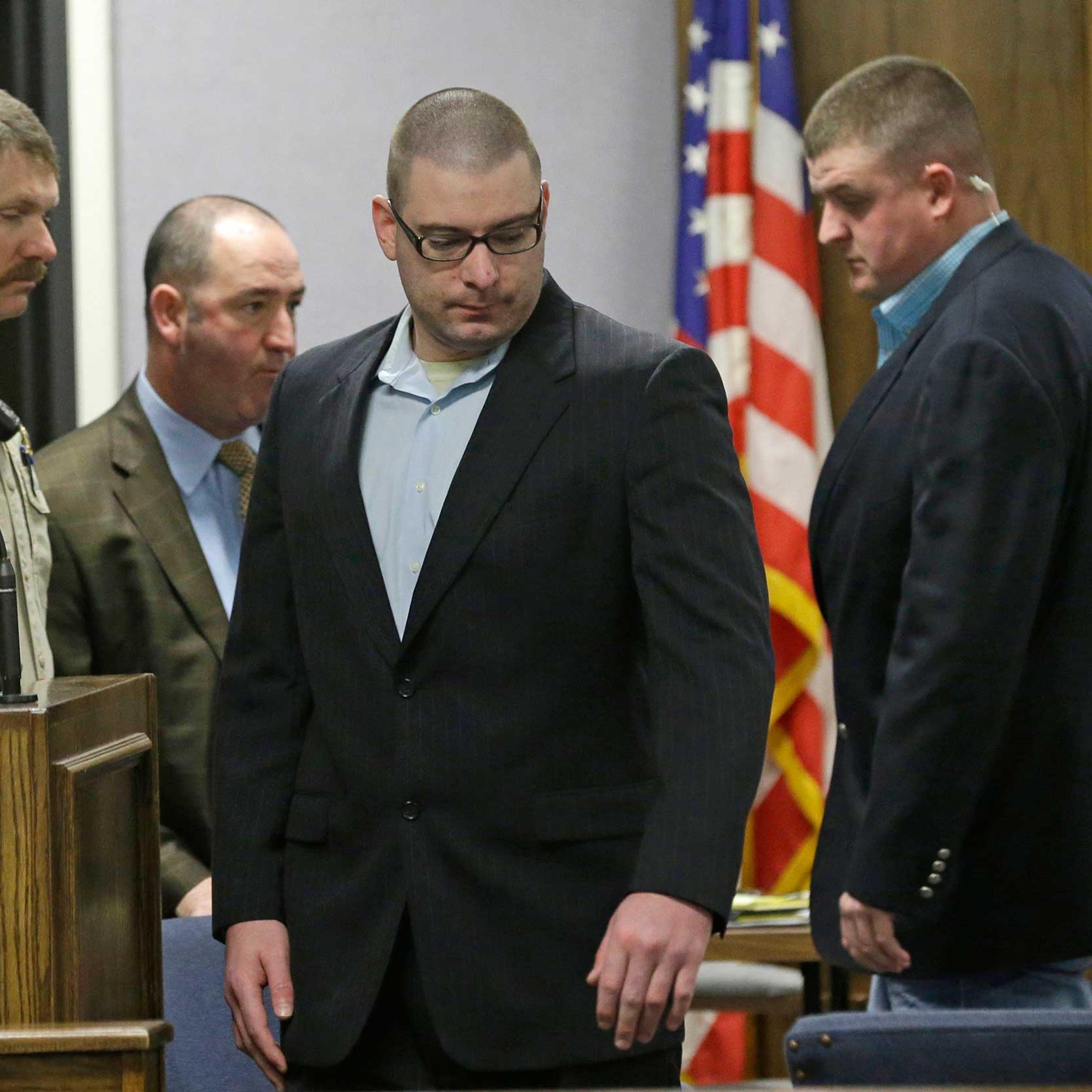Eddie Ray Routh, 27, takes his seat with law enforcement officers a pretrial motion hearing in Stephenville, Texas Feb. 10, 2015.