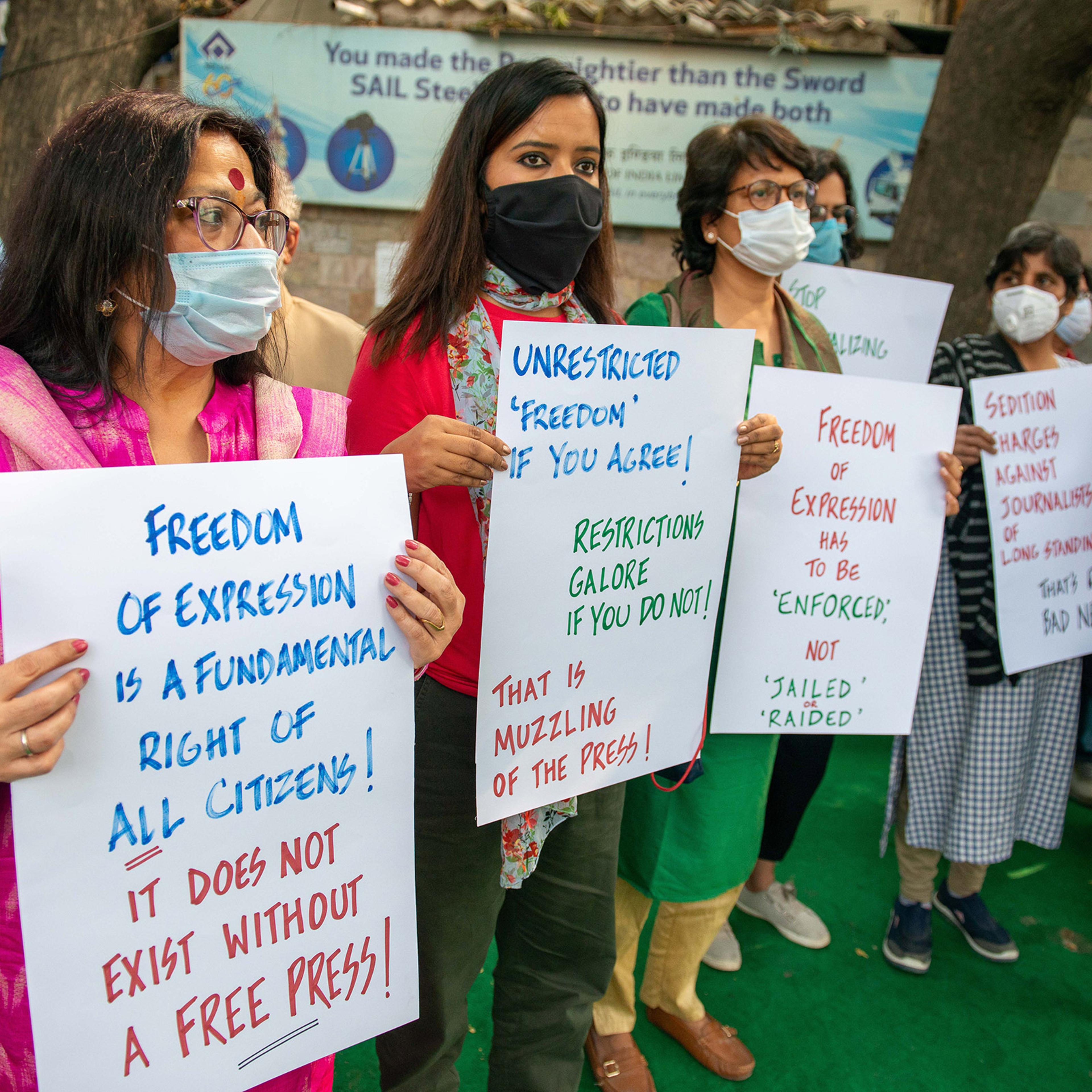 Journalists stage a silent sit-in to protest media gagging outside the Press Club of India in Delhi, on Feb. 18, 2021.