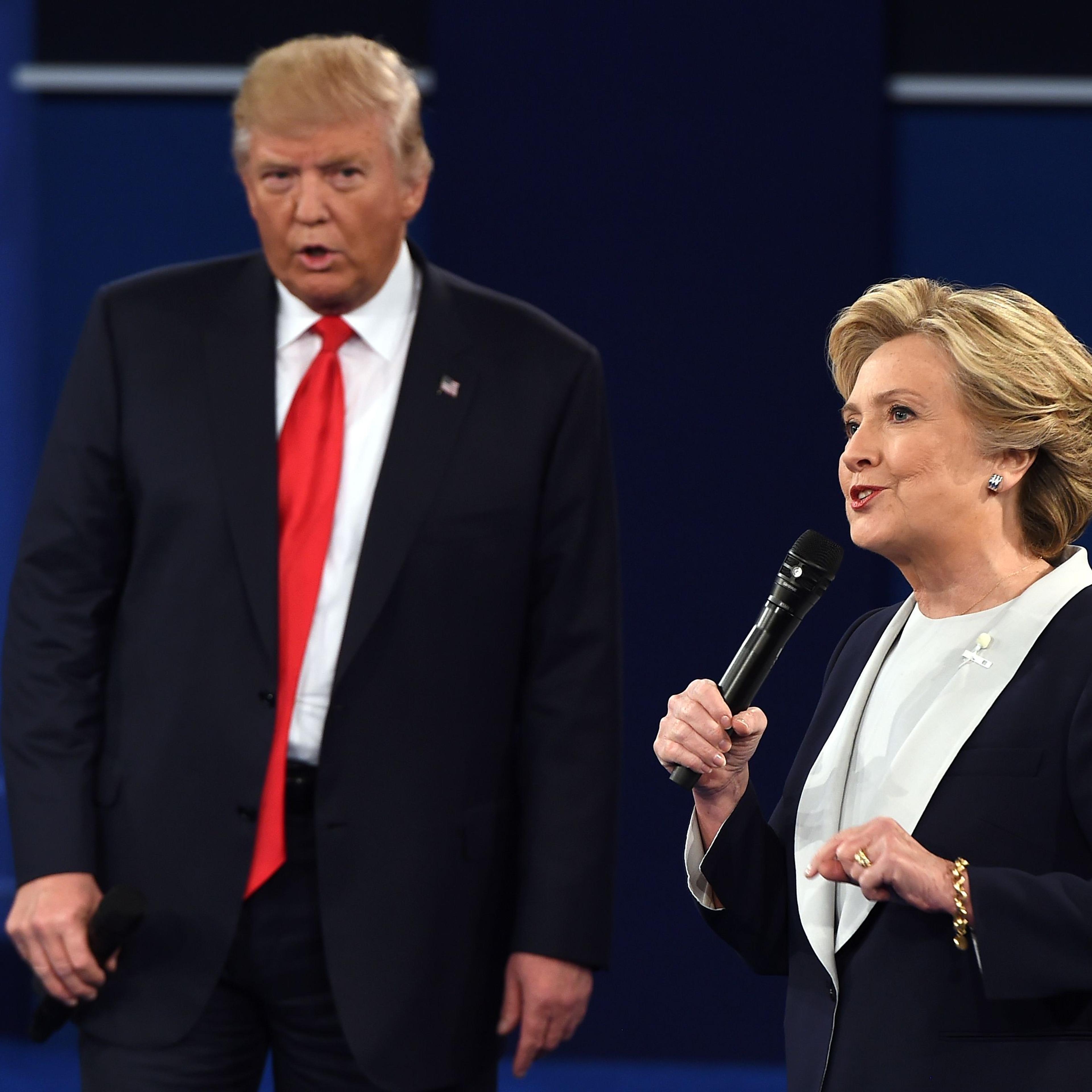 Democratic presidential candidate Hillary Clinton and Republican presidential candidate Donald Trump debate during the second presidential debate at Washington University in St. Louis on Oct. 9, 2016.
