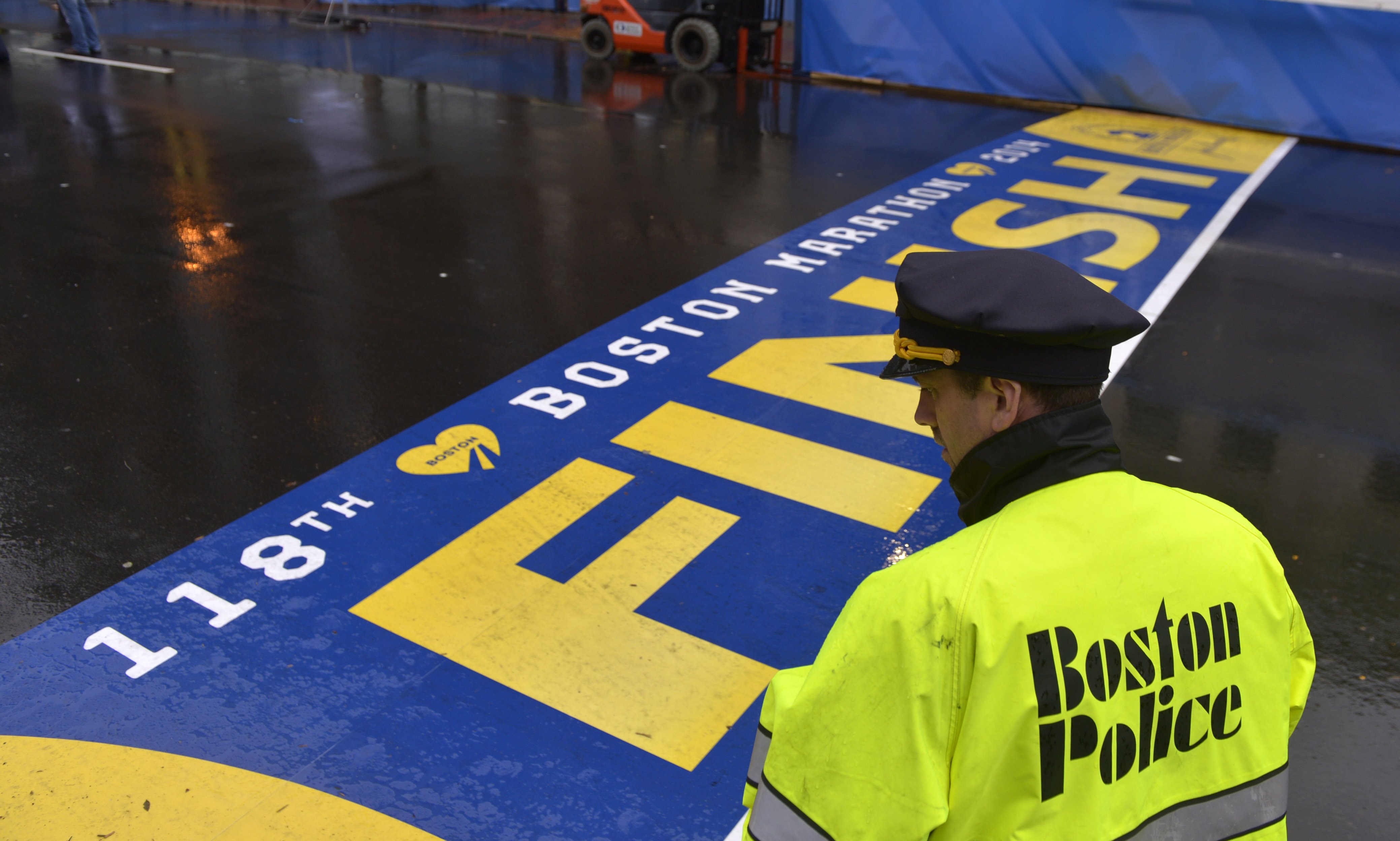 A policeman stands guard during a ceremony commemorating the first anniversary of the Boston Marathon bombings in Boston, on April 15, 2014.