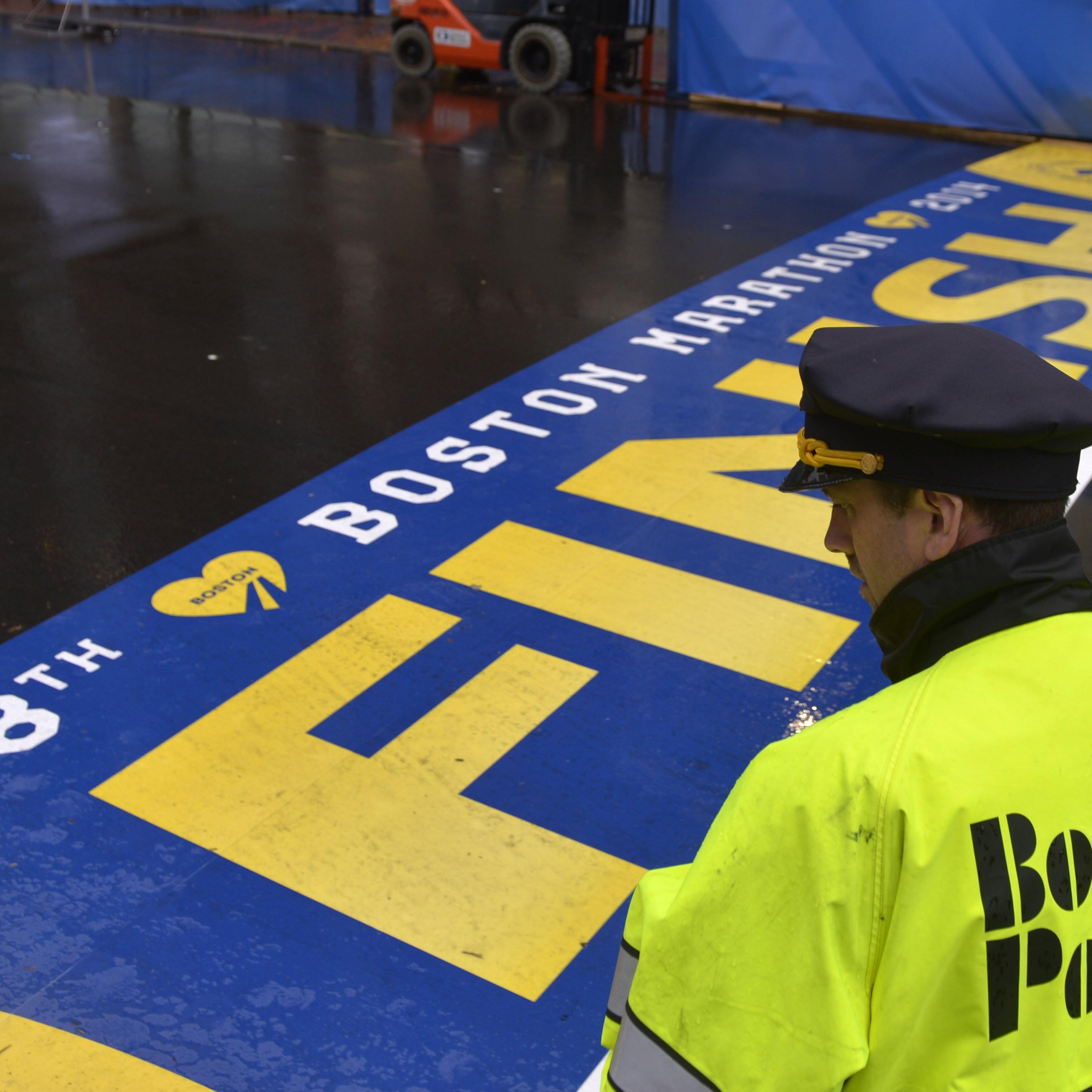 A policeman stands guard during a ceremony commemorating the first anniversary of the Boston Marathon bombings in Boston, on April 15, 2014.
