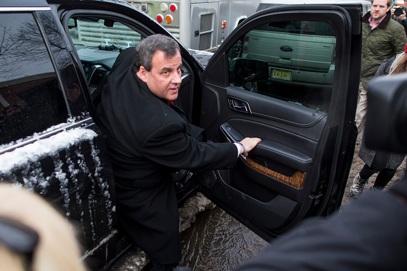 Republican presidential candidate New Jersey Governor Chris Christie exits his SUV outside the polling place at Webster School February 9, 2016 in Manchester, New Hampshire.