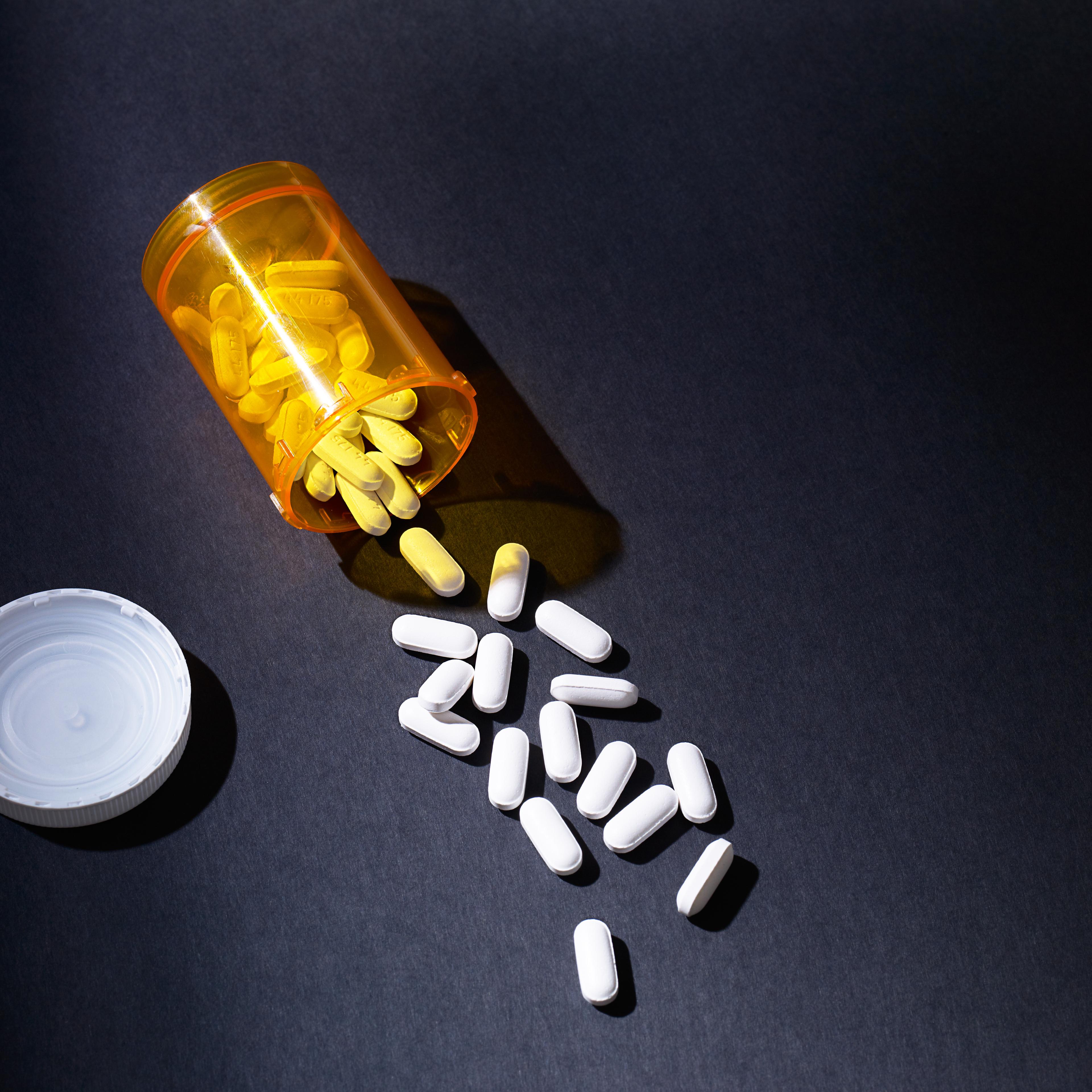 PIlls spilling out of prescription bottle