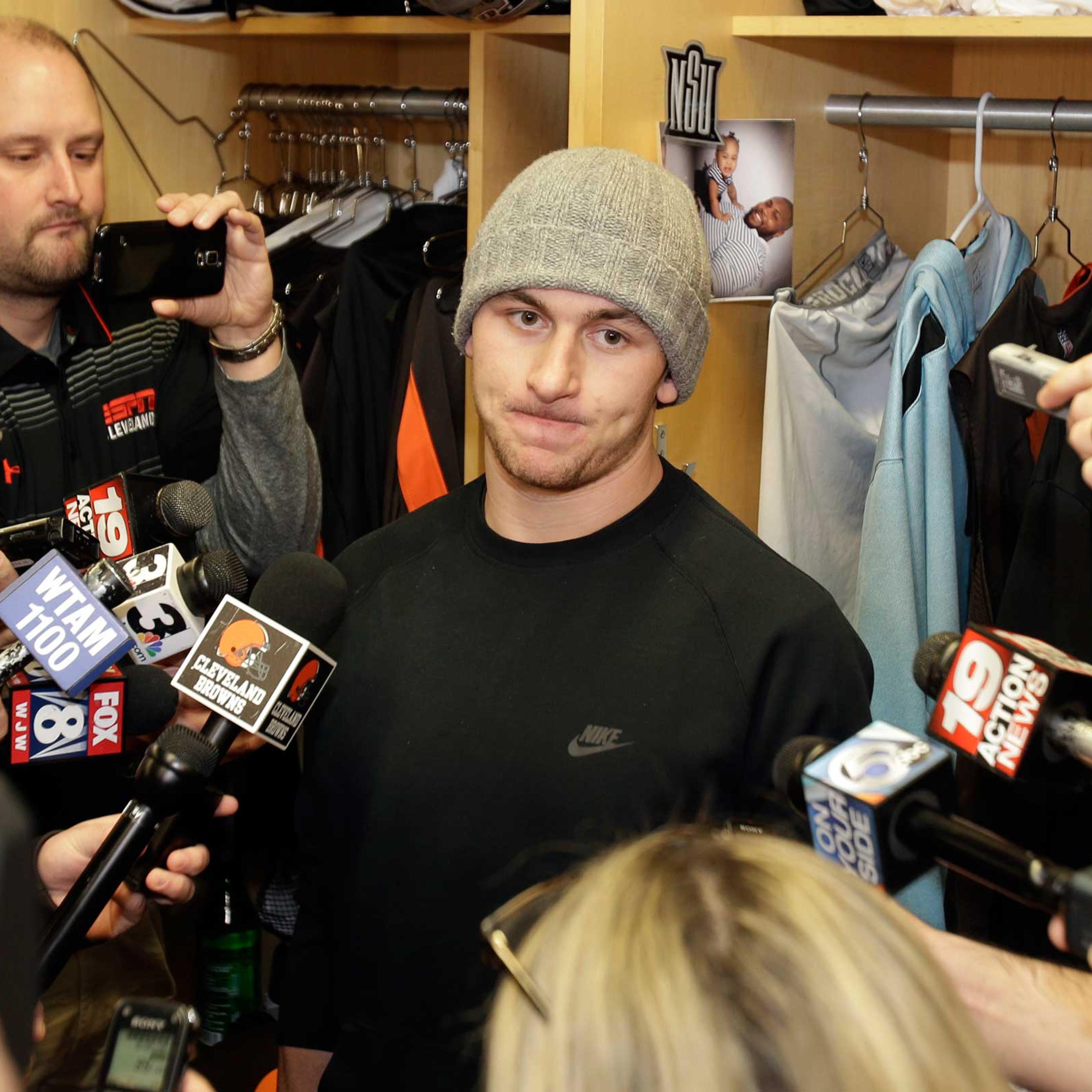 Cleveland Browns quarterback Johnny Manziel talks with the media at the NFL football team's training camp, in Berea, Ohio, Feb. 2, 2015.