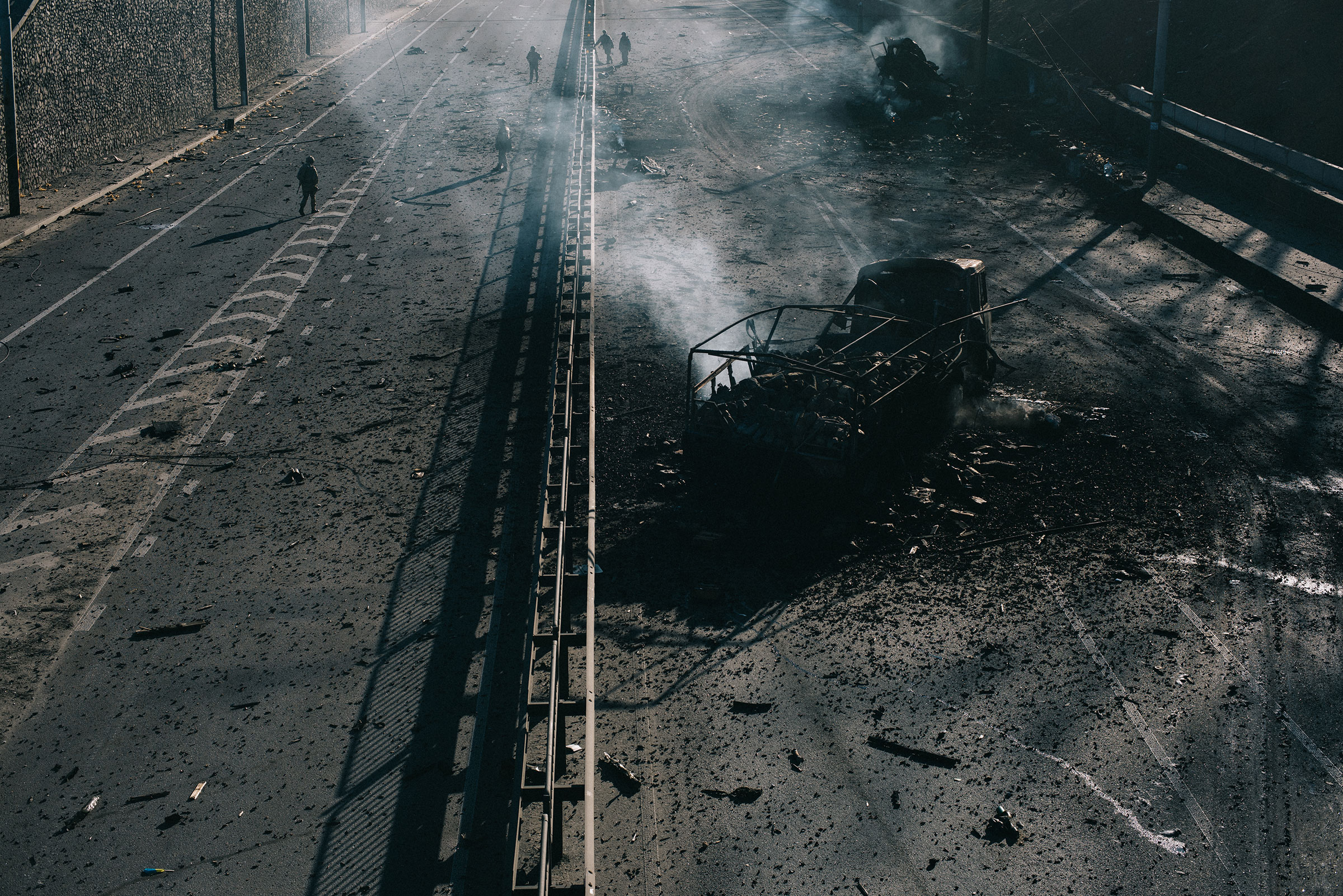 The burned-out husk of a Russian military vehicle sits on a highway leading into Kyiv. It was destroyed by Ukrainian forces as they defended the capital on the third night of the Russian invasion