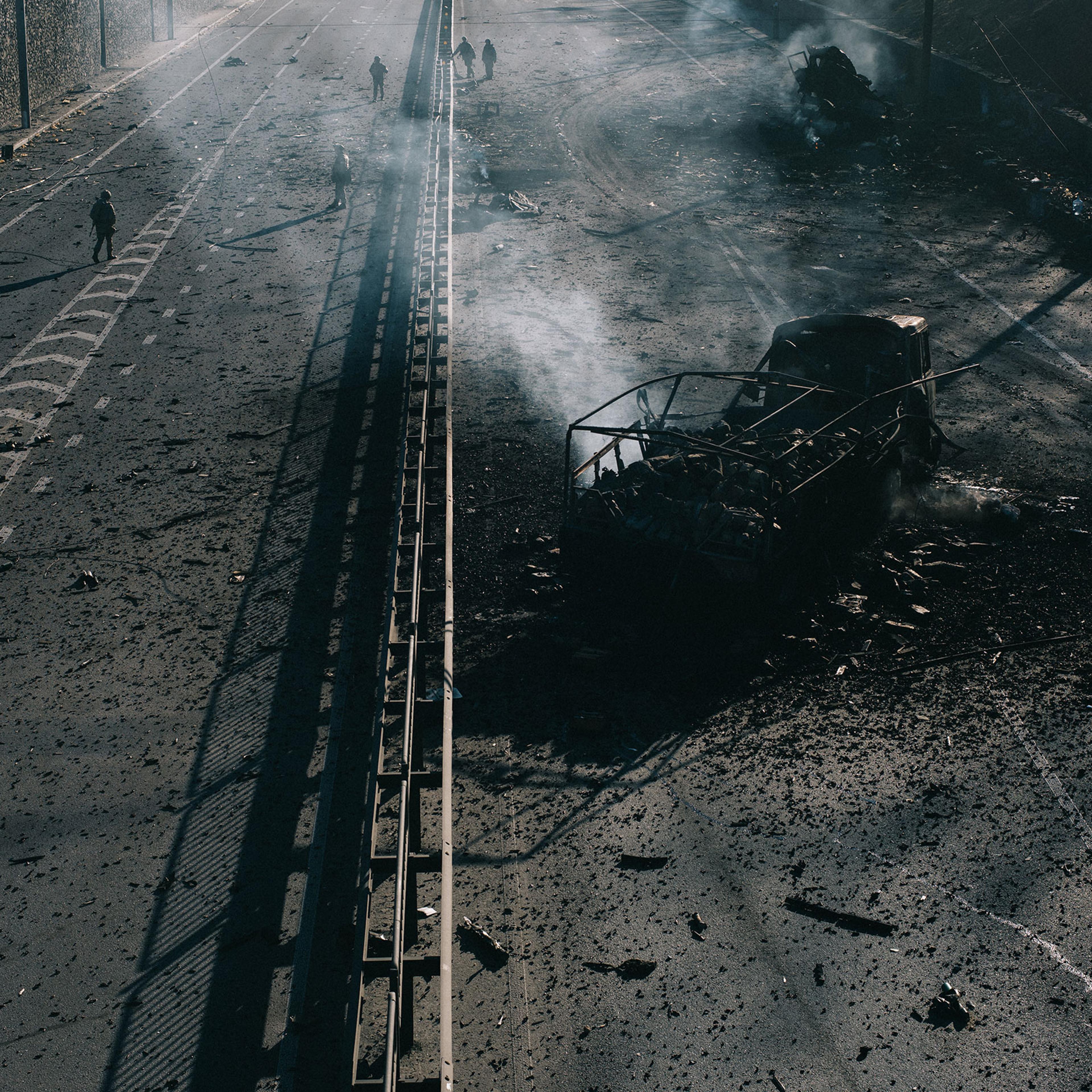 The burned-out husk of a Russian military vehicle sits on a highway leading into Kyiv. It was destroyed by Ukrainian forces as they defended the capital on the third night of the Russian invasion
