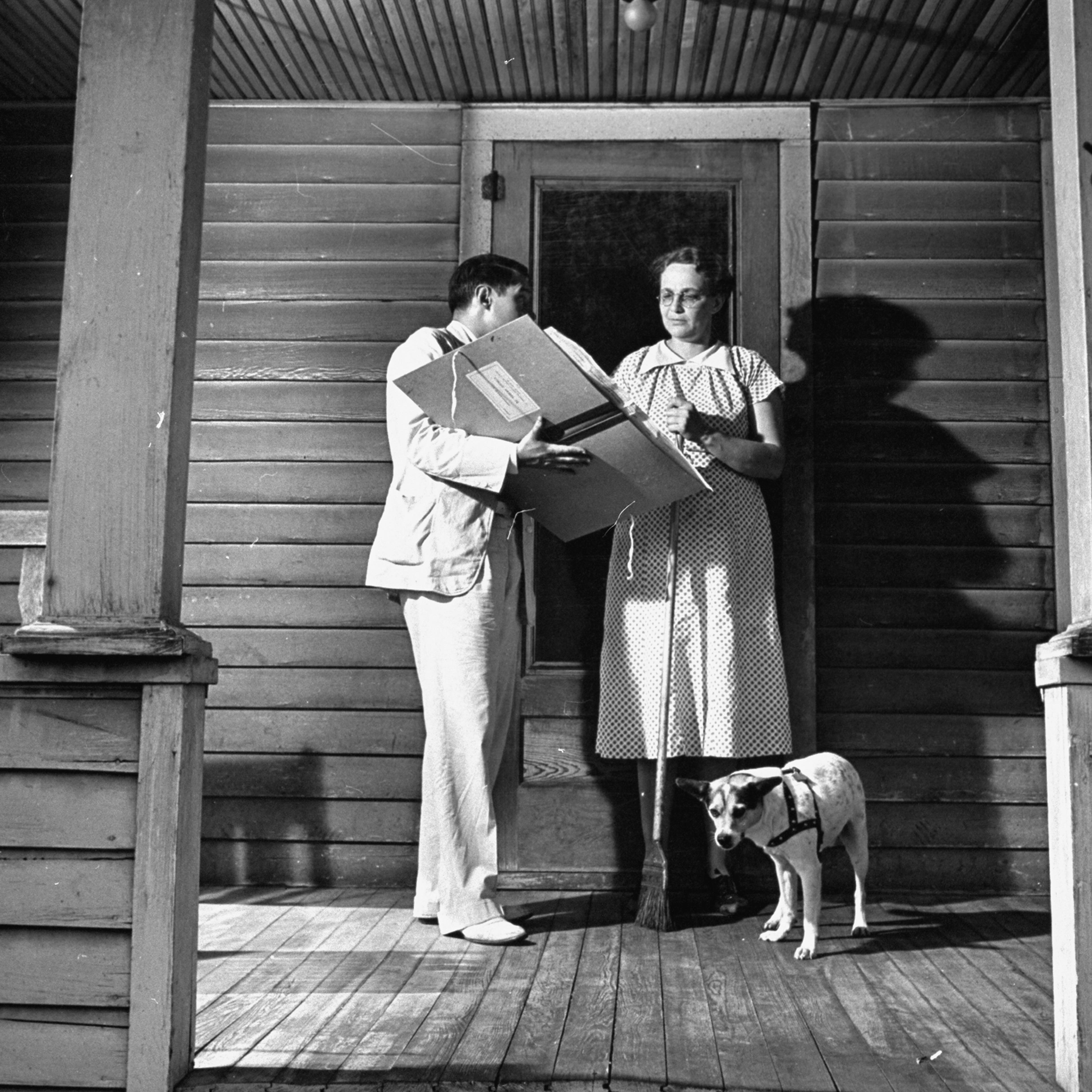 Census taker talking with a housewife on