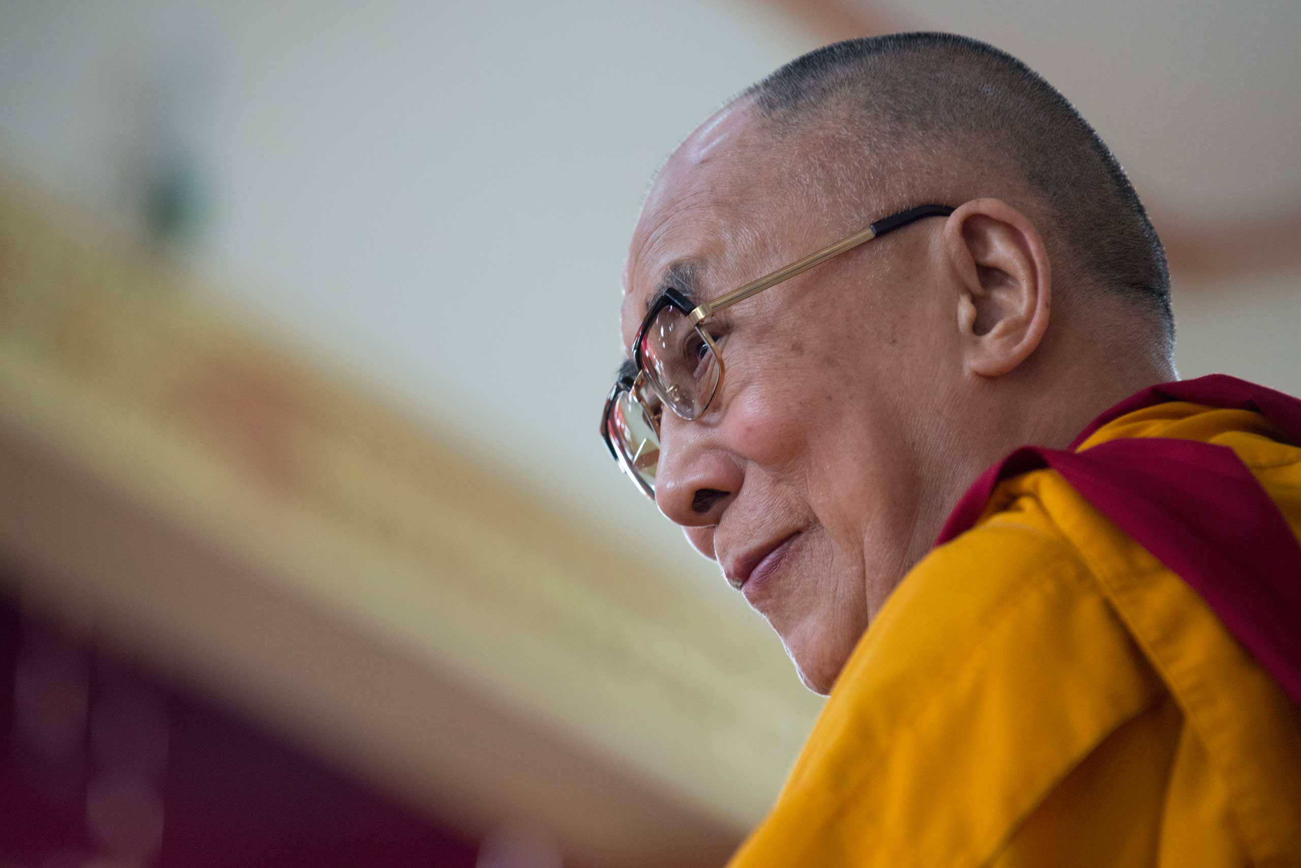 His Holiness the Dalai Lama on the teaching throne during the Jangchup Lamrim teachings in Mundgod in December 2014.