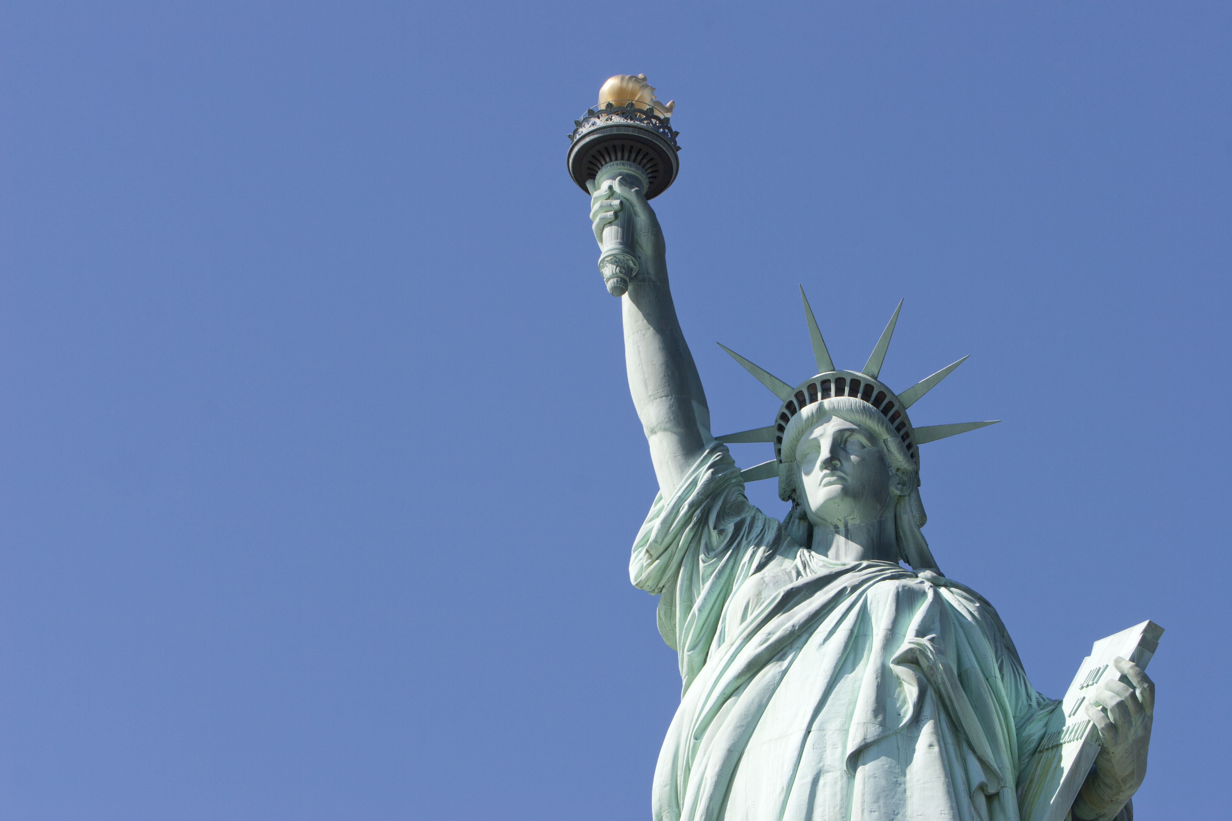Statue of Liberty on a blue sky day