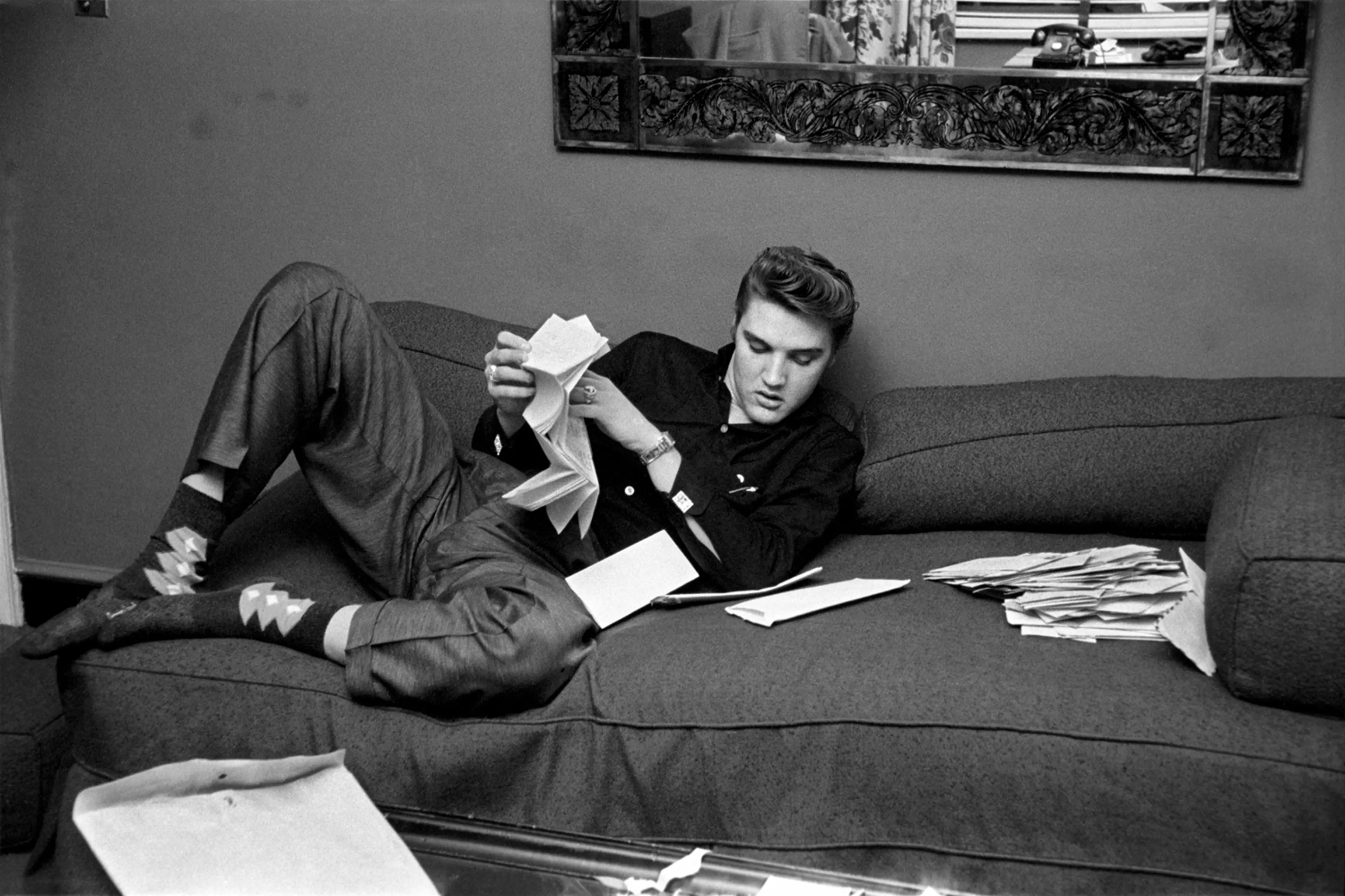 March 17, 1956. The Warwick, New York. We got into his room and there was an envelope on the couch with about a hundred letters from fans inside. He plopped down on the couch, pulled his shoes off (exposing his argyle socks) and proceeded to read some of the fan mail. Some letters were six or seven pages long and he was going to read every page. After he finished reading them, he tore them up, explaining "I don't want anyone else reading my mail and I'm not taking it with me."