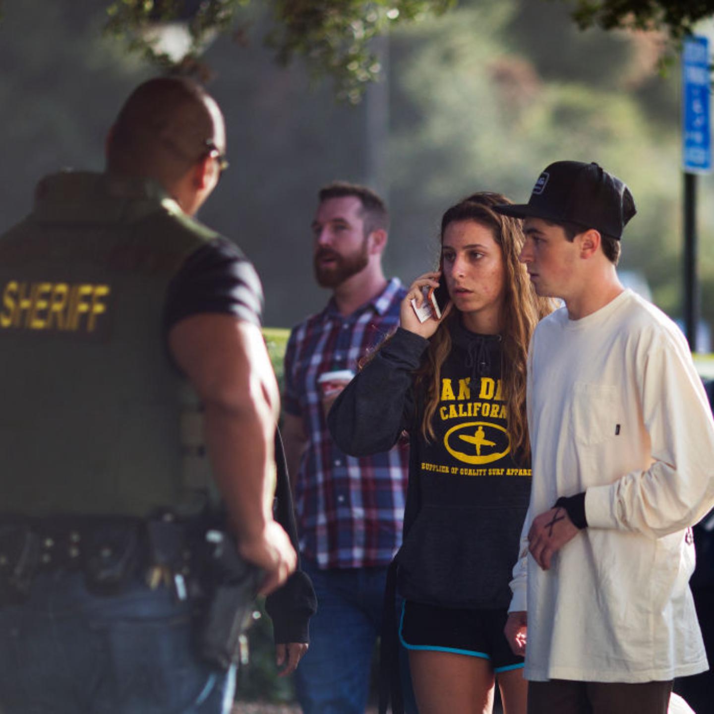 People arrive to a family assistance and reunification center following a mass shooting at the Borderline Bar and Grill after Thousand Oaks Shooting