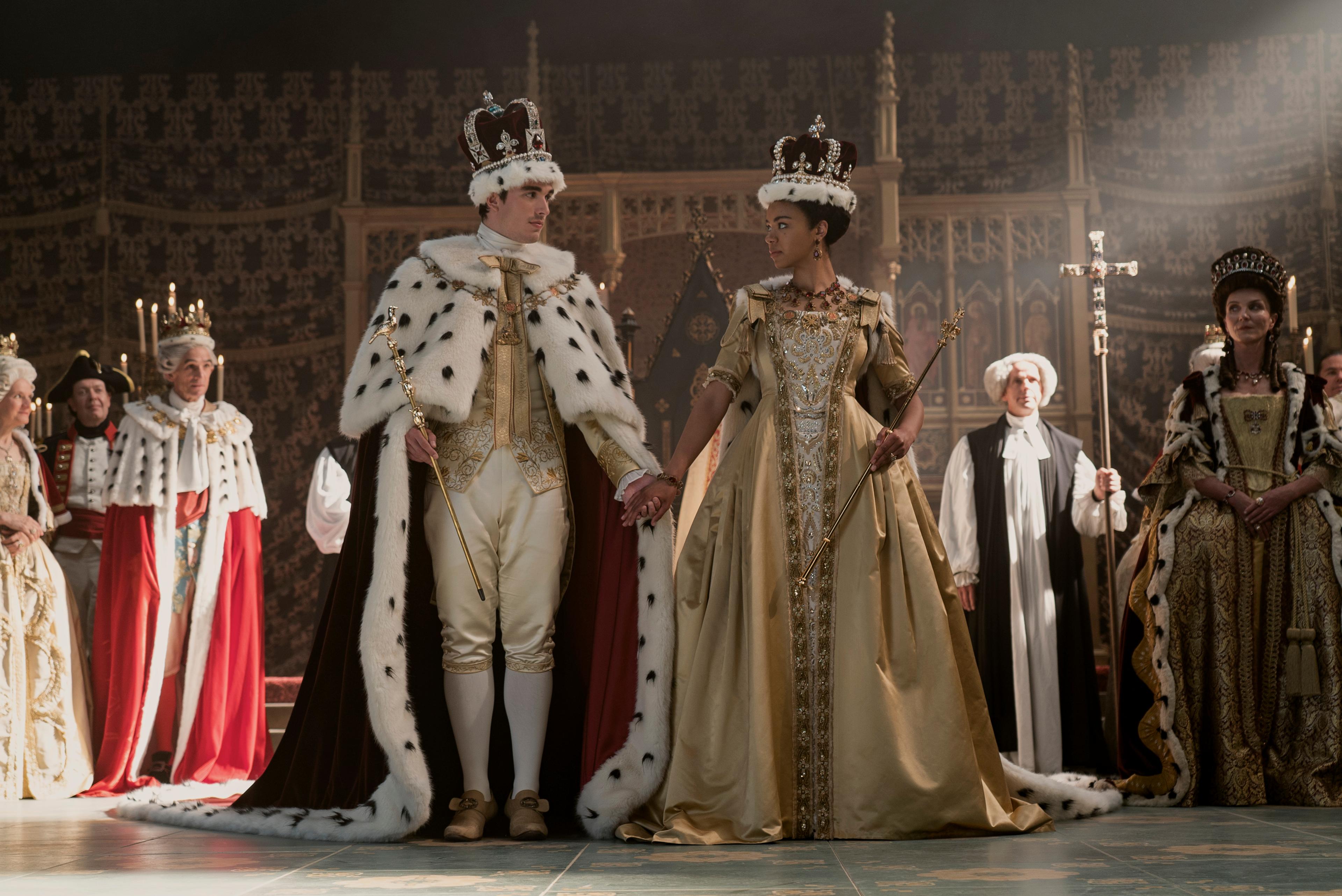 Queen Charlotte: A Bridgerton Story. (L to R) Corey Mylchreest as Young King George, India Amarteifio as Young Queen Charlotte, Michelle Fairley as Princess Augusta in episode 103 of Queen Charlotte: A Bridgerton Story. Cr. Liam Daniel/Netflix © 2023