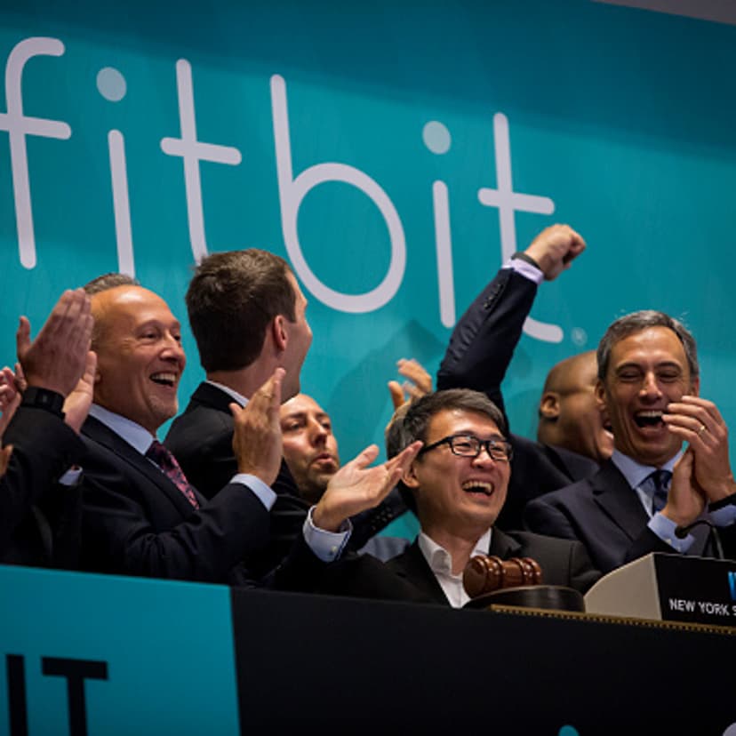 Fitbit Chief Executive James Park (C) rings the bell for the company's IPO debut at the New York Stock Exchange on June 18, 2015.
